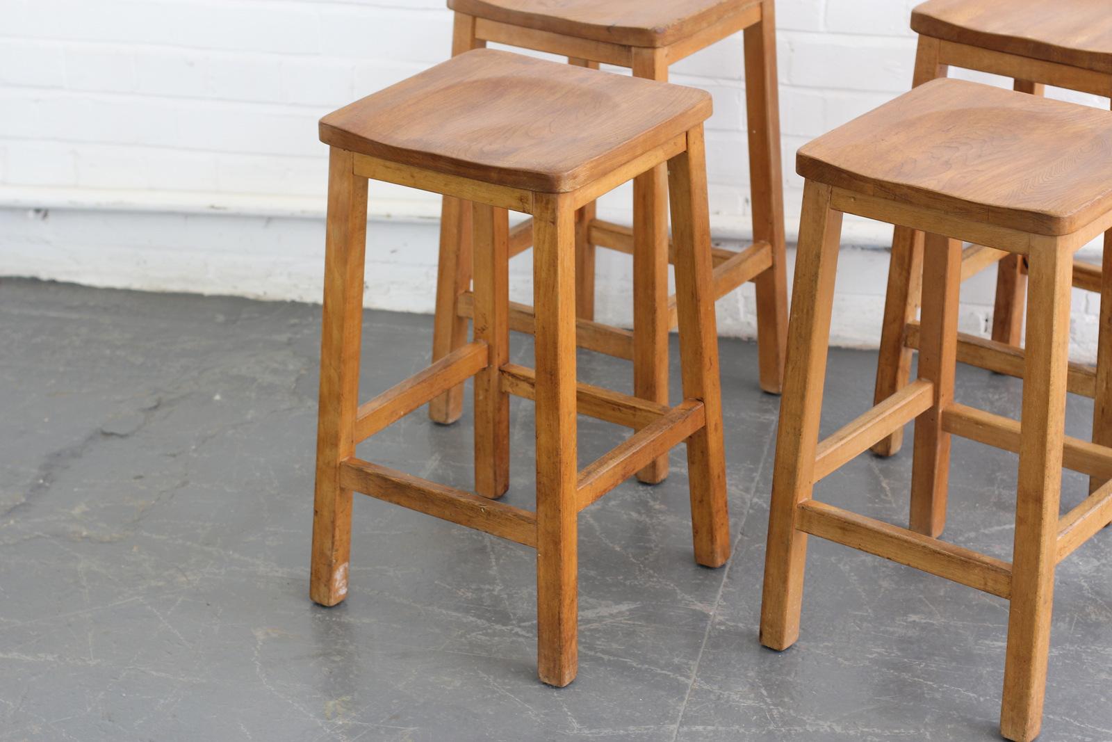 English elm school lab stools, circa 1950s.

- Price is per stool (4 available)
- Solid elm shaped seats
- Beech frame
- English, circa 1950s
- Measures: 33cm x 33cm x 62cm

Condition report:

Each stool has been re set to ensure it's