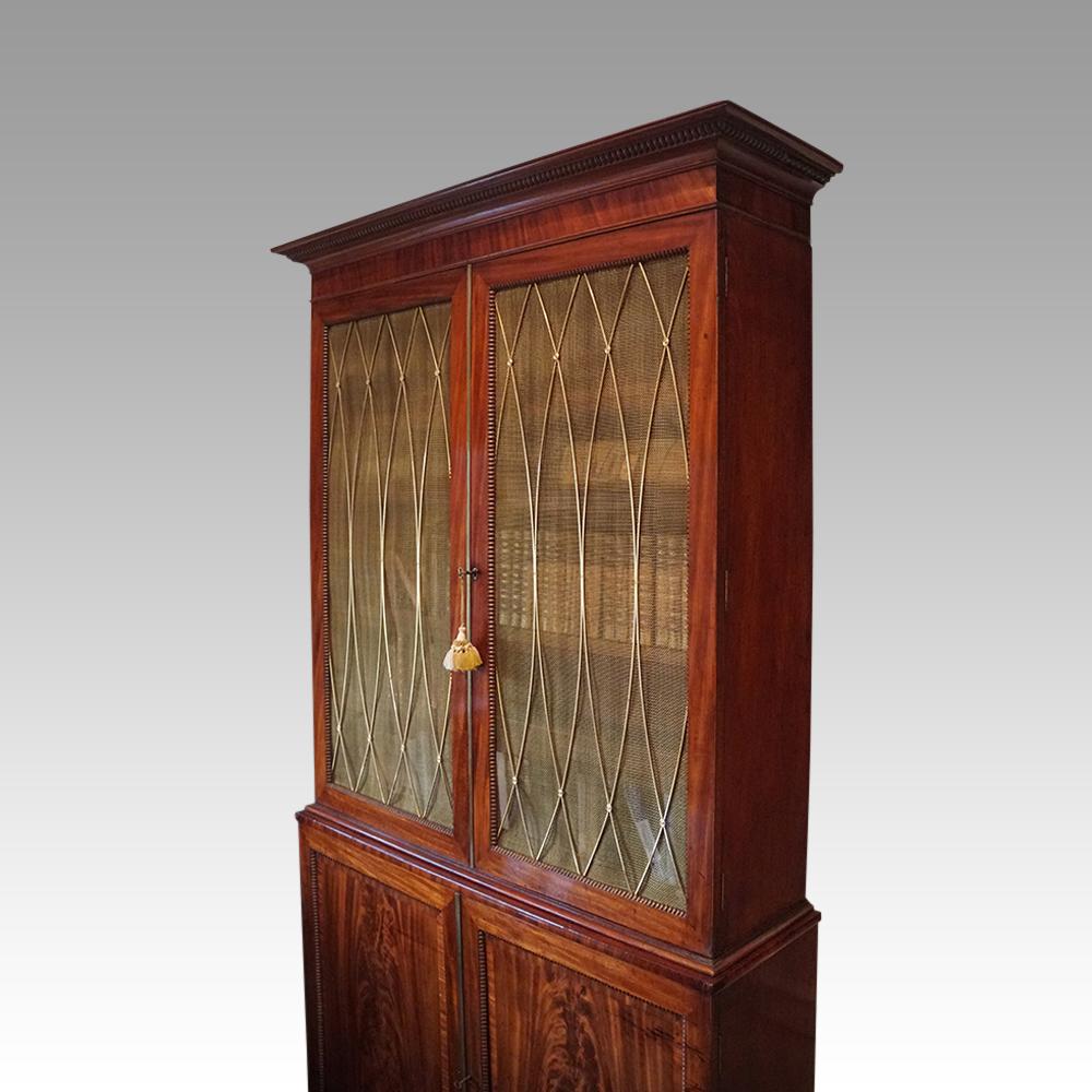 William IV mahogany library bookcase, of an important height. 
This William IV mahogany library bookcase was made circa 1820 and would have been commissioned for a very important English home. It would have been placed in the library where it would