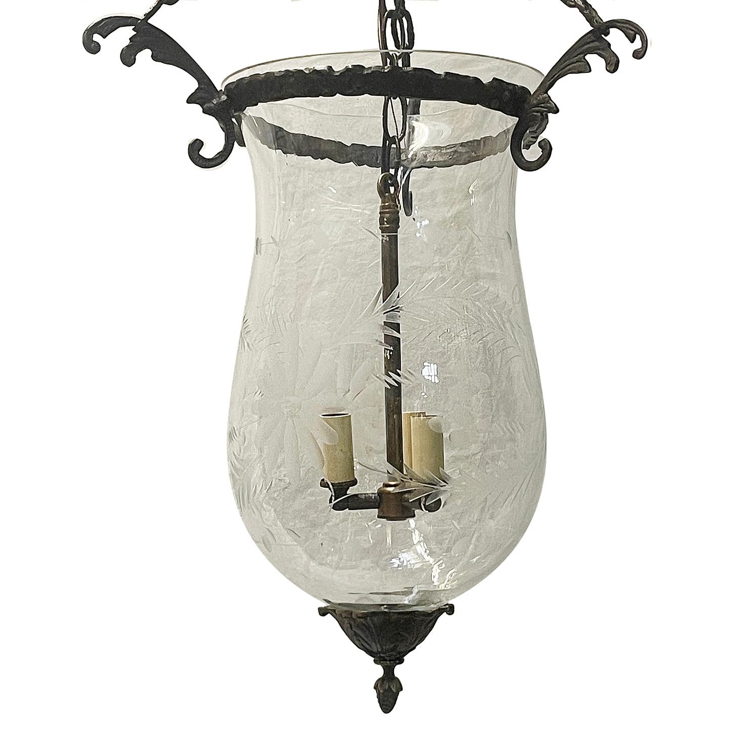 A circa 1940's etched glass lantern with patinated bronze fittings and etched glass. 3 Candelabra lights.

Measurements:
Height: 34