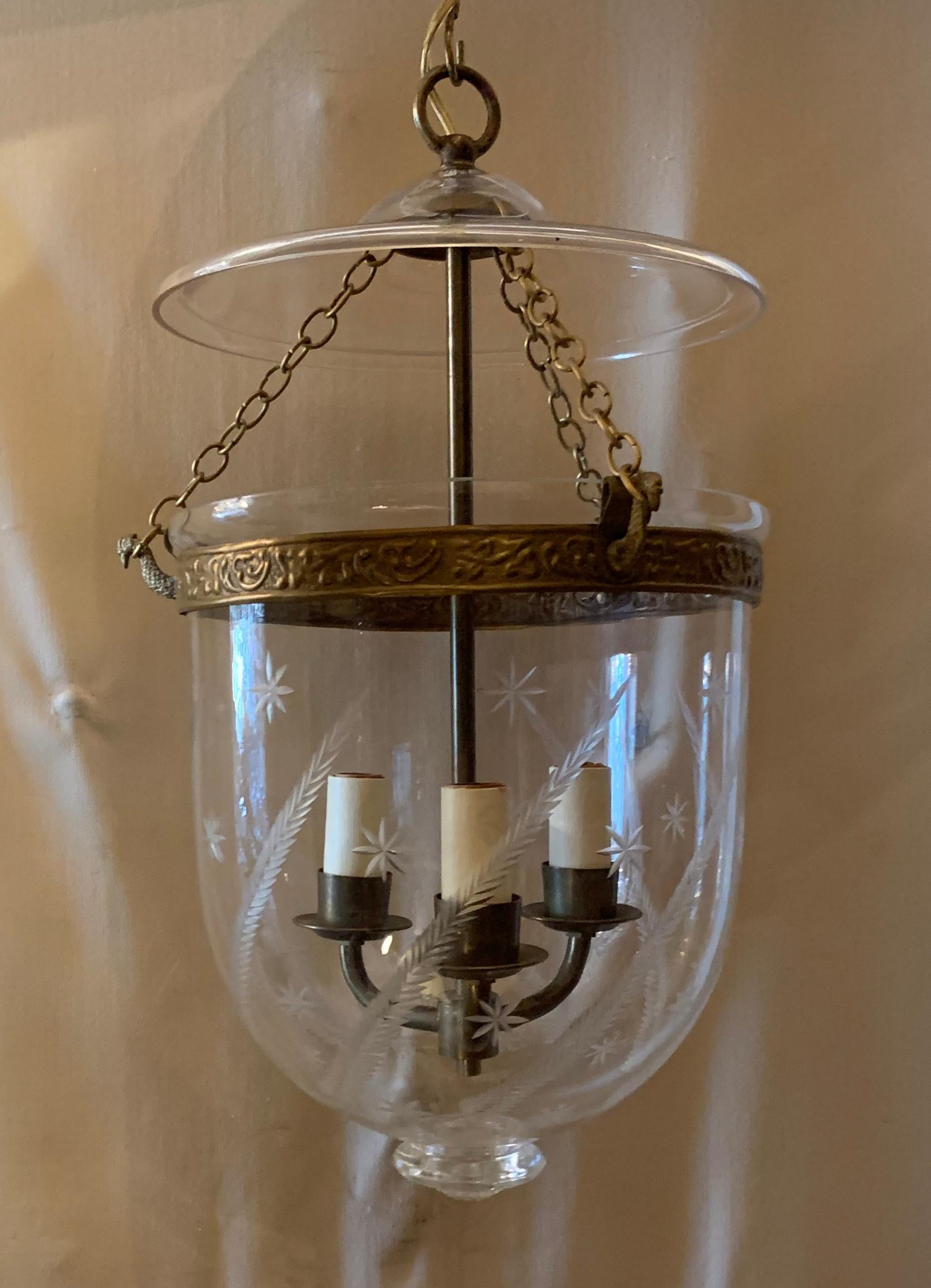 A wonderful English etched star and wheat blown glass bell jar lantern pendant fixture with brass hardware that has 3 candelabra lights and has been rewired and comes with chain canopy and mounting hardware for installation.