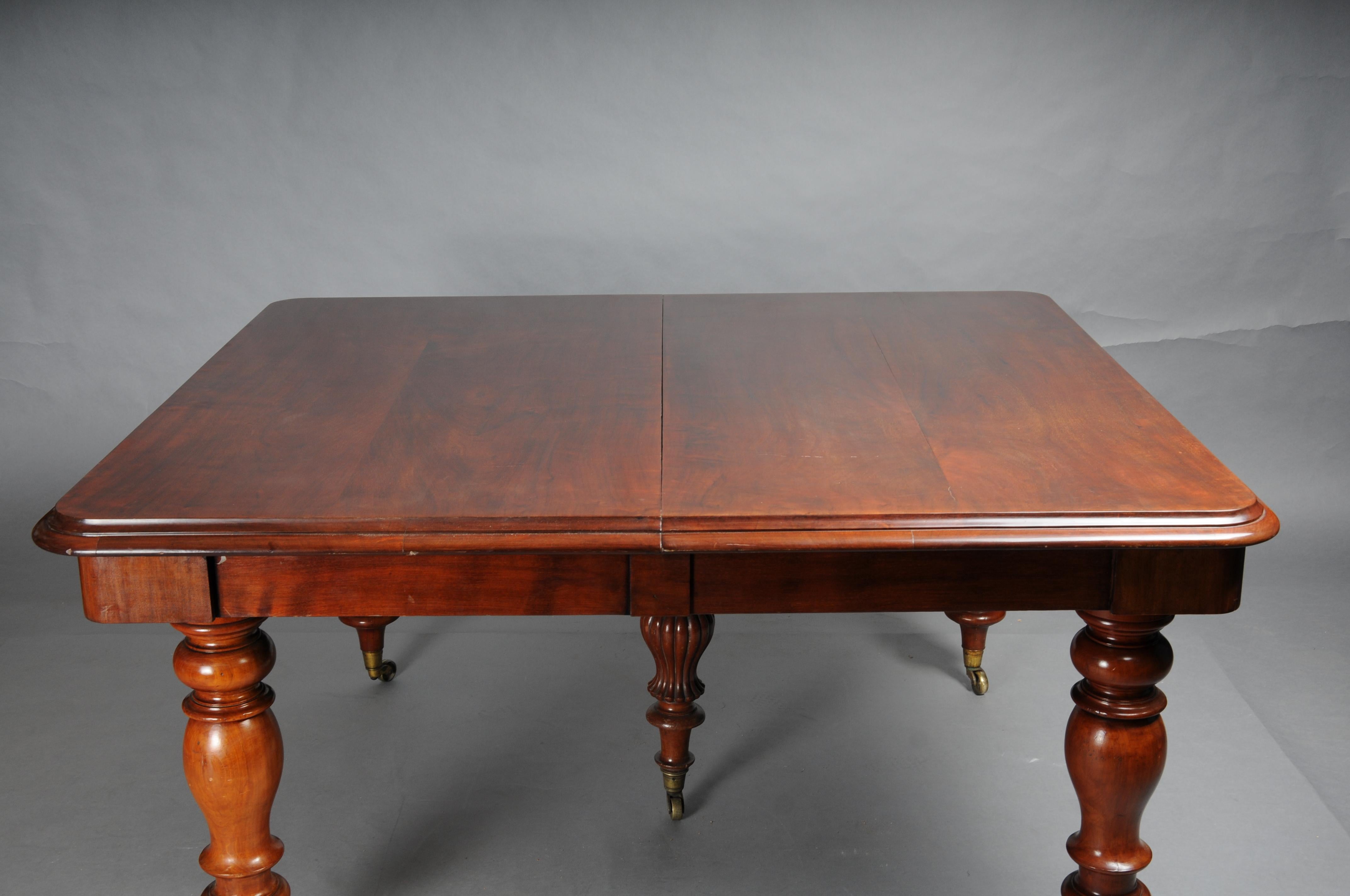 English Extendable Dining Table, Mahogany, circa 1860

Solid mahogany with five turned columns, also made of solid mahogany. The dining table is extendable, with three additional solid shelves, but the mechanical mechanism for extending the table