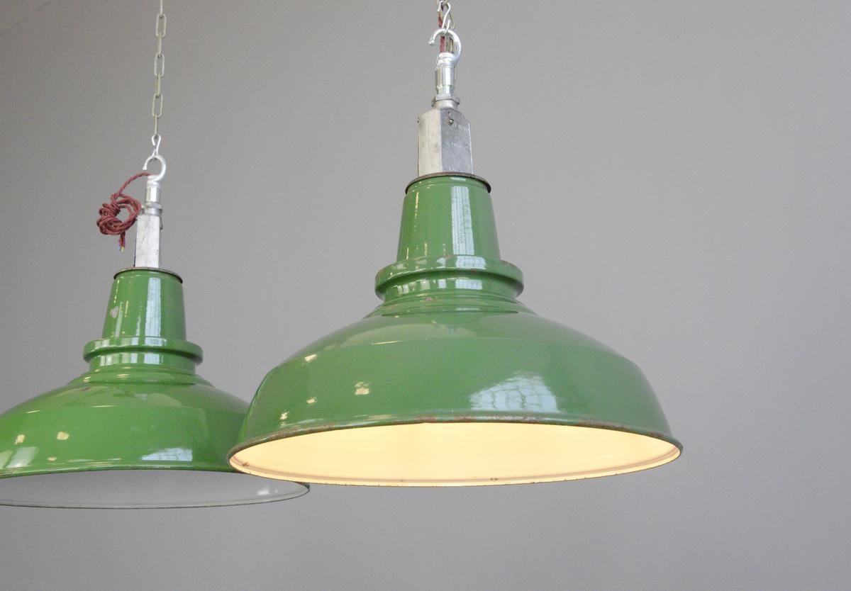 English factory lights by Thorlux, circa 1950s.

- Price is per shade 
- Vitreous green enamel shades 
- White enamel inner reflectors
- Twist off shades for easy cleaning
- Comes with 100 cm of red braided cable
- Takes E27 fitting bulbs
-