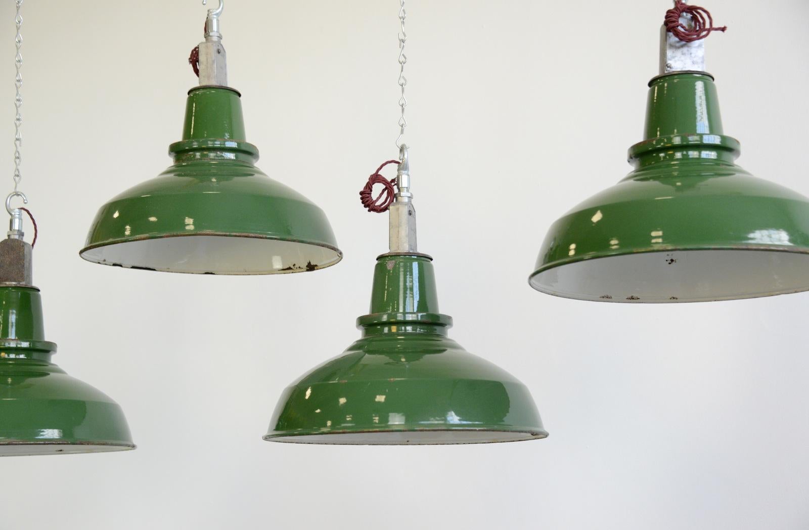 English factory lights By Thorlux, circa 1950s

- Price is per shade (seven available)
- Vitreous green enamel shades 
- White enamel inner reflectors
- Twist off shades for easy cleaning
- Comes with 100 cm of red braided cable
- Takes E27