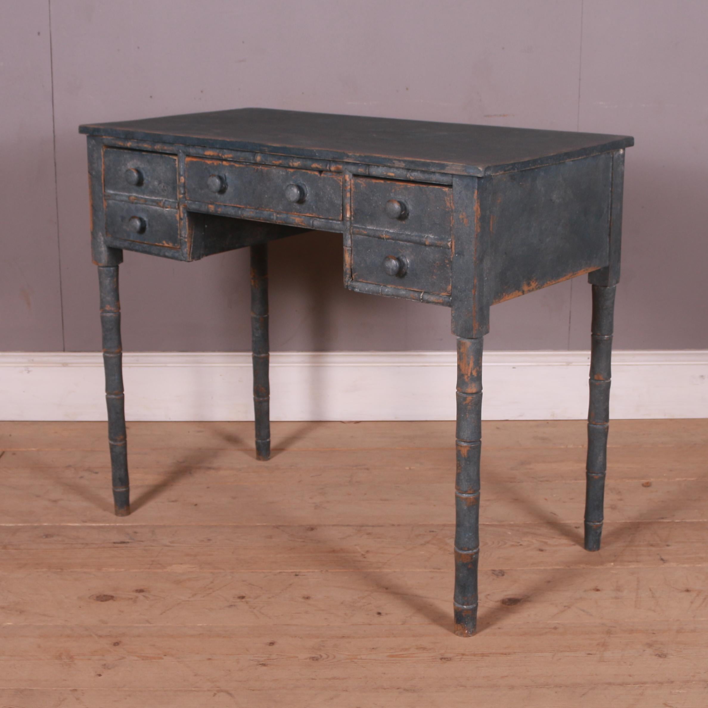 Small early 19th C English faux bamboo pine desk / side table. 1830.

Centre clearance is 14