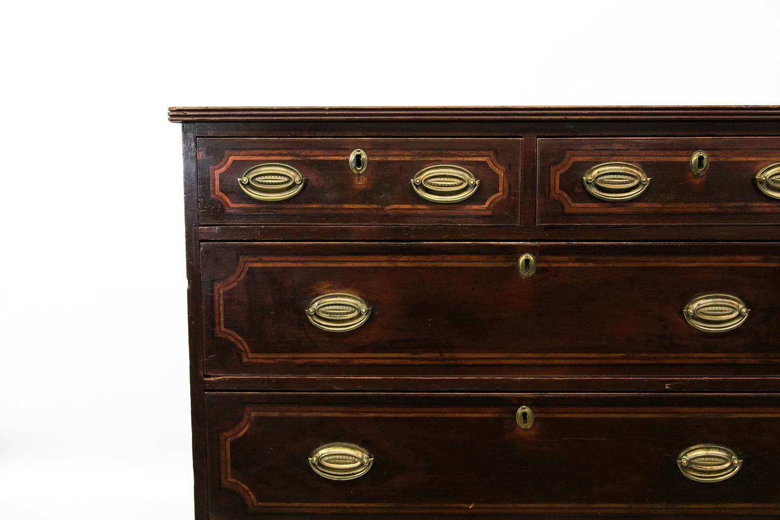 English faux painted five-drawer chest is all original, including the hardware. The top has reeded edging and the drawers and top have been painted to simulate ebony and other inlays.