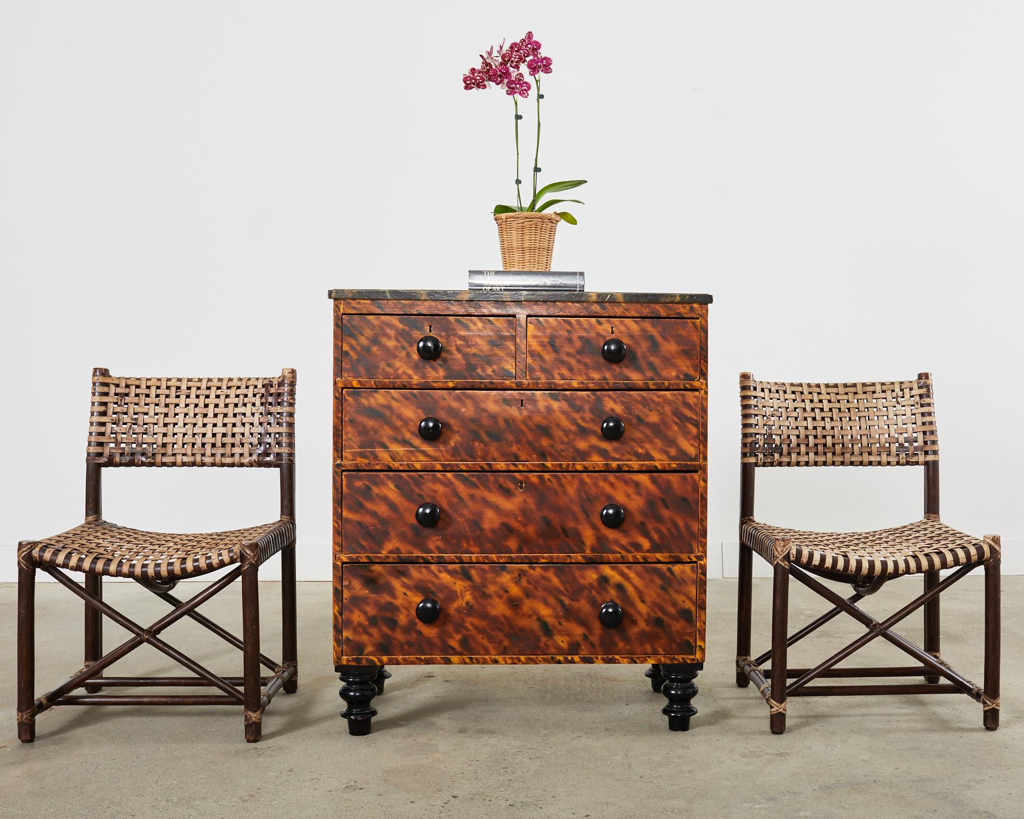 Fantastic 19th century country English pine dresser, commode, or chest of drawers lacquered by artist Ira Yeager (American 1938-2022) in the late 20th century. The dresser features a pine case with a faux-marble lacquered top in black with gold and