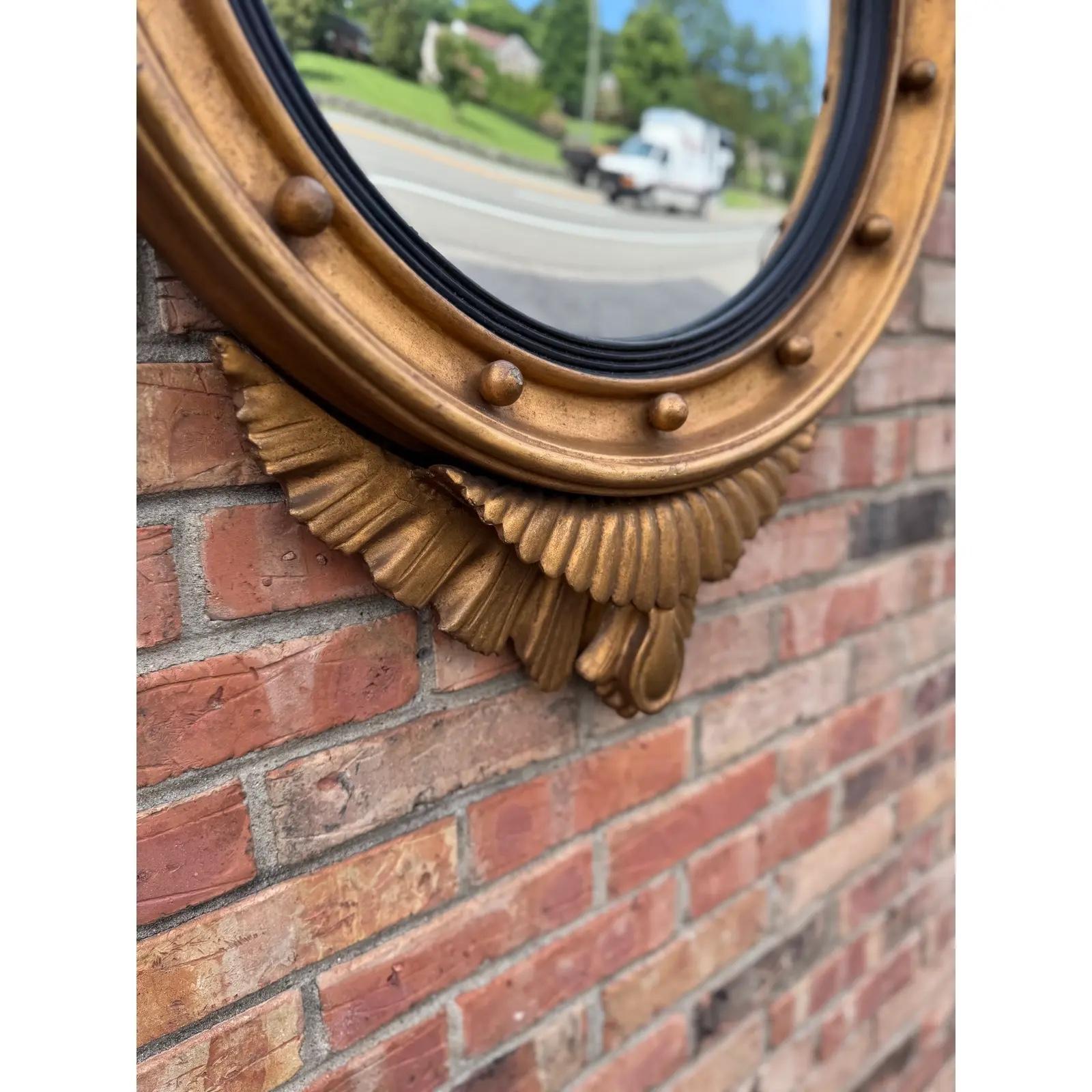 This is a very nice Late 19th Century Federal style English mirror. Featuring the traditional eagle with wings spread 14 round balls surrounding the circle, The bottom has a wooden ornate decorative piece. The eagle is in good condition with no past