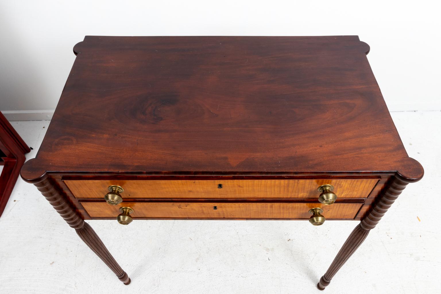 English Federal style inlaid and banded mahogany and satinwood server with two drawers, federal style brass pulls, and turned legs, circa 1920s. The first drawer is fitted for flatware. Made in England. Please note of wear consistent with age along