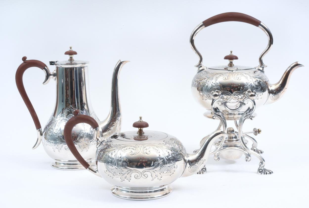 English silver plate with wood handle five-piece tea or coffee service with Kettle on stand. The tea or coffee service is in excellent vintage condition, maker's mark undersigned. Tea pot 10