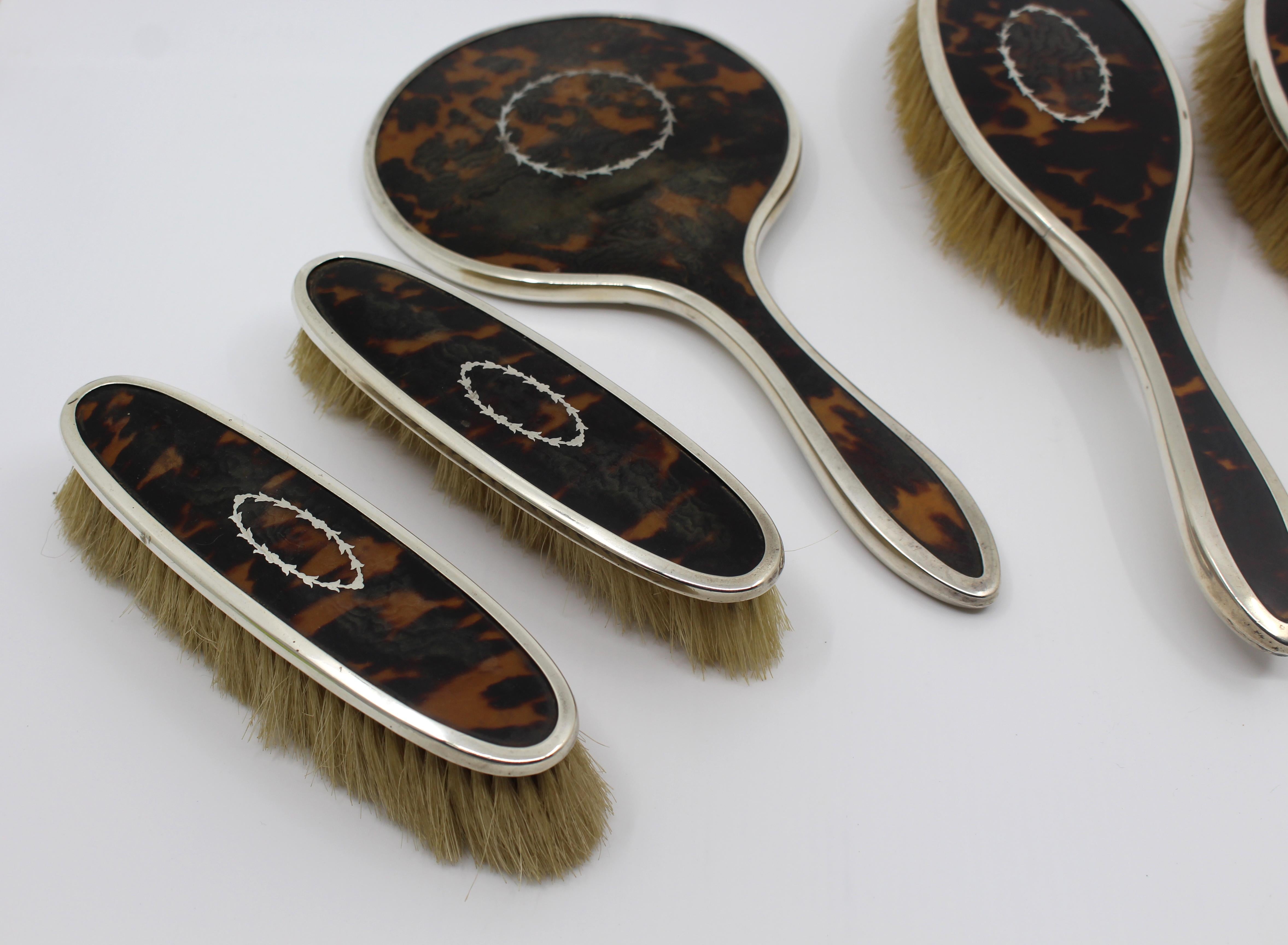 Period early 20th century, English
Maker F H Adams & Co.
Hallmark Birmingham, 1923
Pieces 5 pieces: pair of clothes brushes, vanity mirror and pair of hair brushes
Condition Very good condition. Each piece fully hallmarked. Some wear and a few