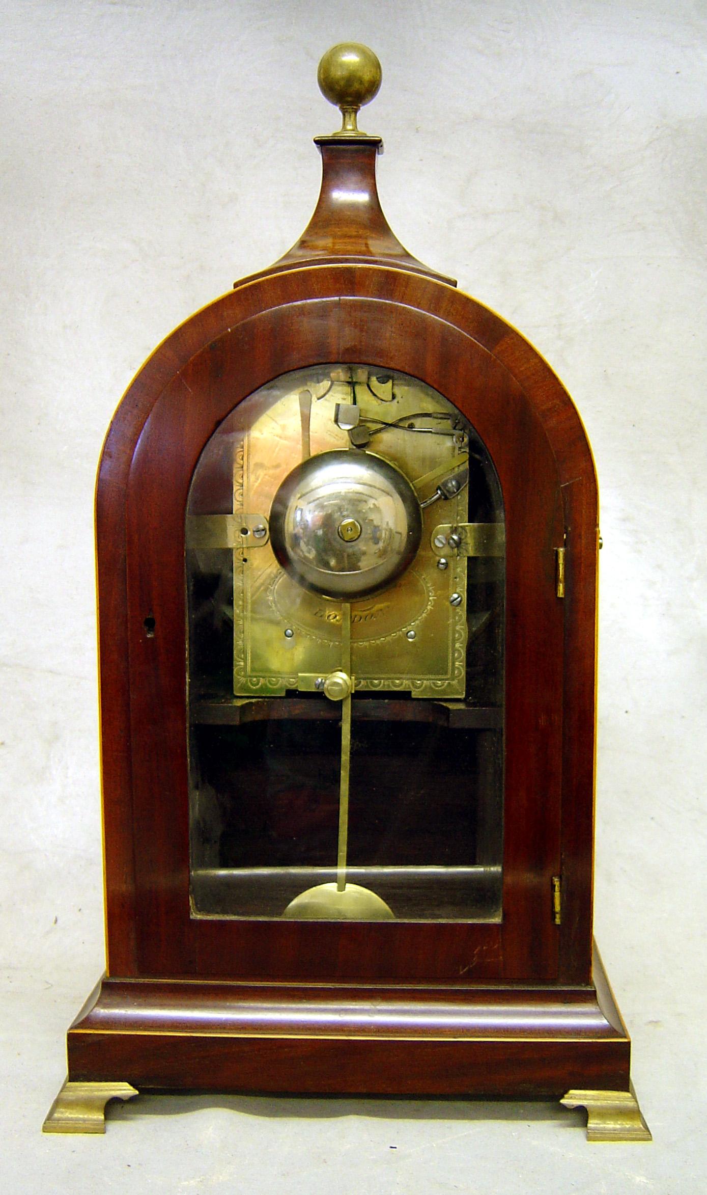 A fine and unusual English, George III mahogany and satinwood inlaid bracket clock. The twin fusee movement most unusually chiming the quarters on two bells as well as striking the hours. Signed on the dial and the backplate James Duncan, London.