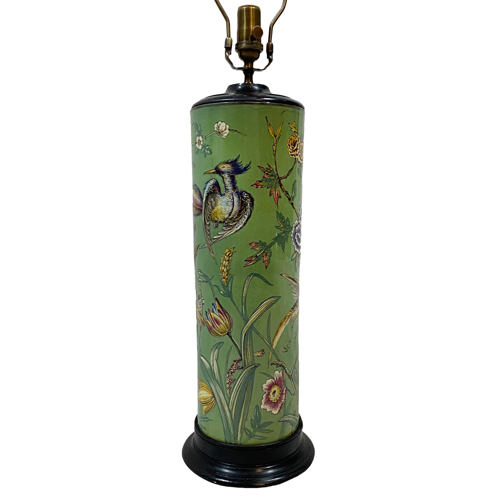 An antique circa 1950's English glazed green porcelain table lamp with hand-painted floral and bird decoration.

Measurements:
Height of body: 21.5