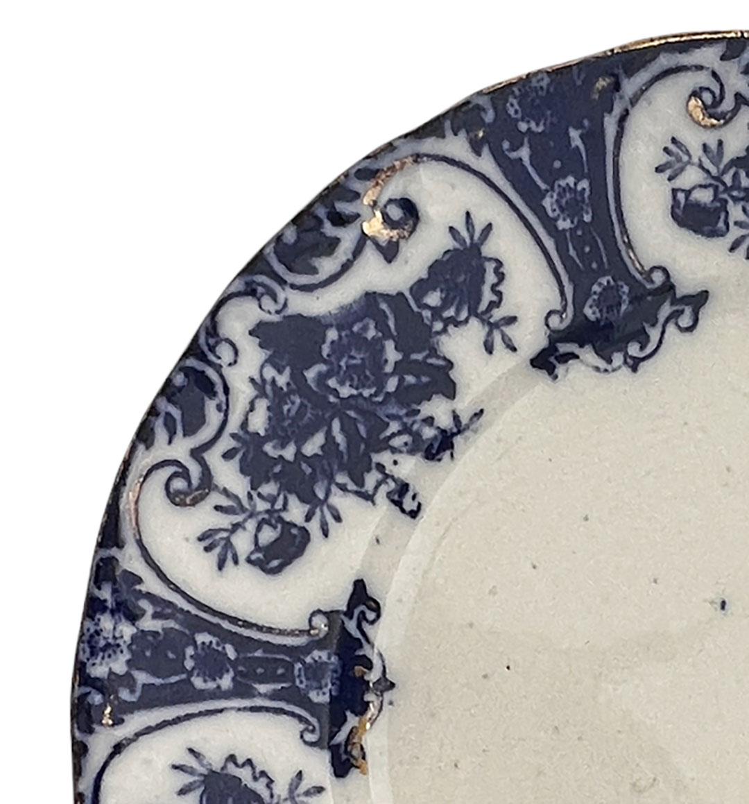 Antique English flow blue transferware plate stamped Regent.