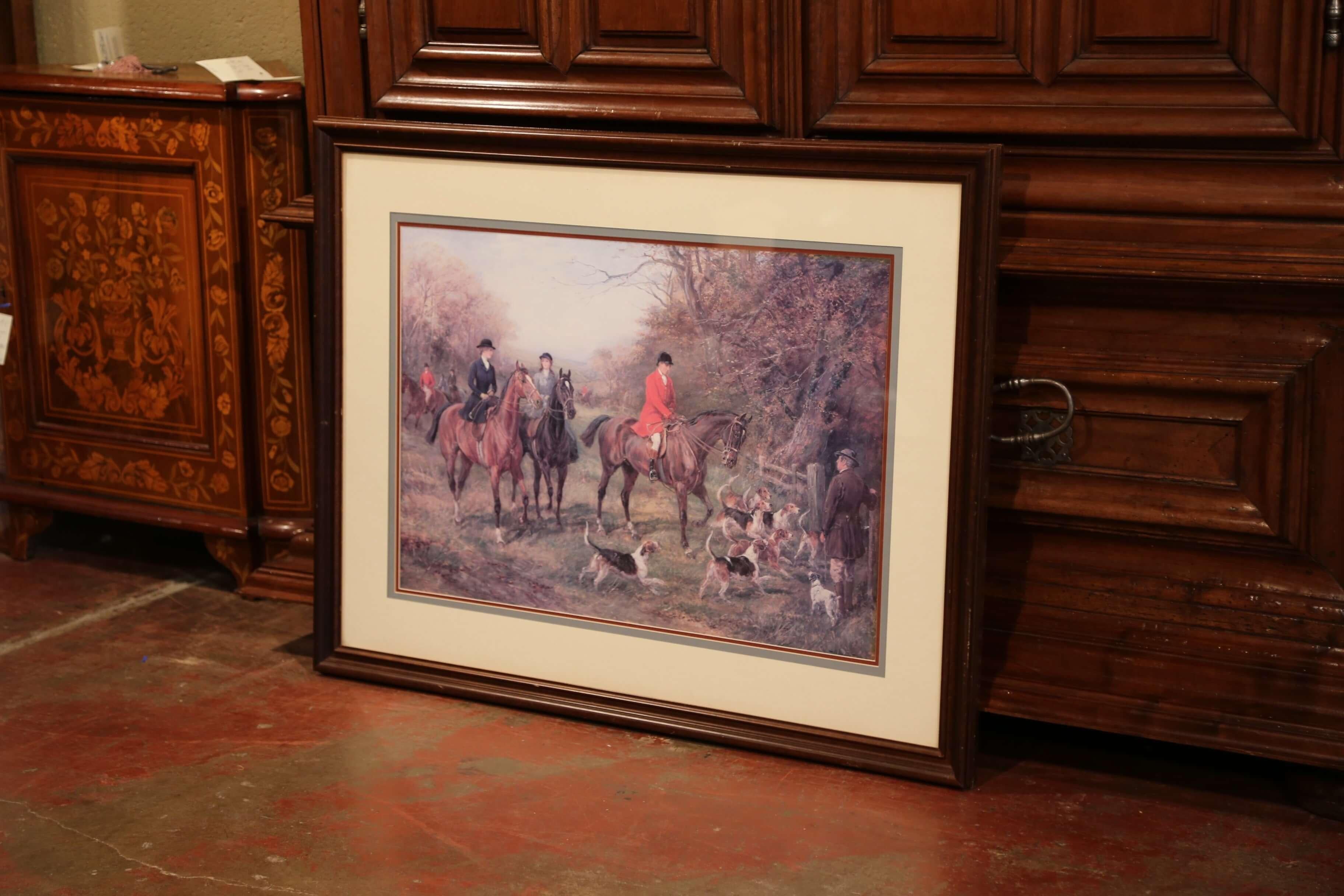 Large vintage print from England, crafted, circa 1950, the framed piece depicts a hunt with horse, dogs and hunters.
