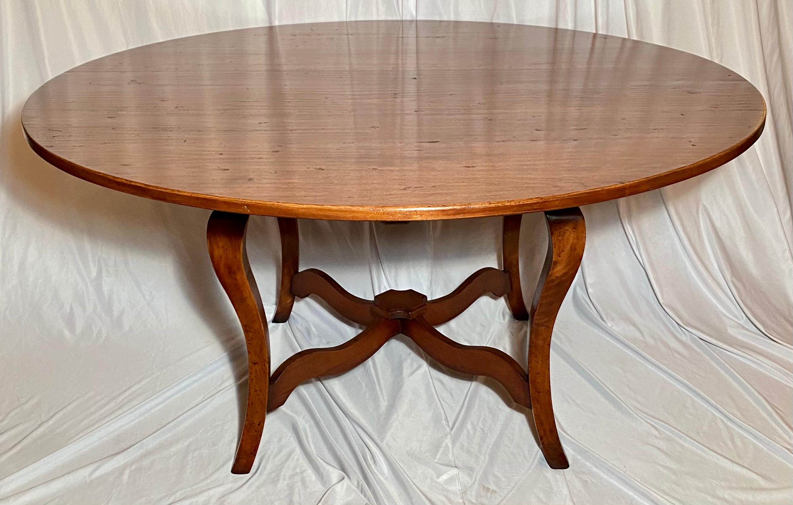 English fruitwood round table on pedestal.

  