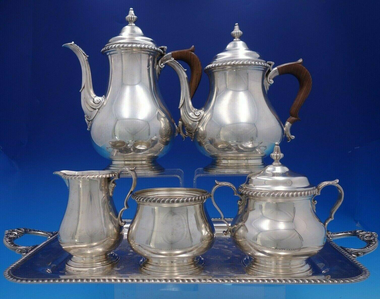 English Gadroon

English Gadroon sterling silver 5-piece piece tea set with plated tray.
The coffee pot measures 10