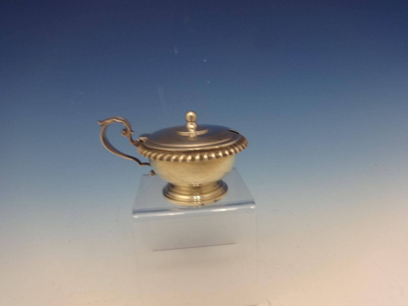 English Gadroon by Gorham sterling silver mustard pot marked #324 with the monogram MCM. This piece measures 1 3/4 tall, 2 3/4 wide, and weighs 2.5 ozt. It is in excellent condition.


 