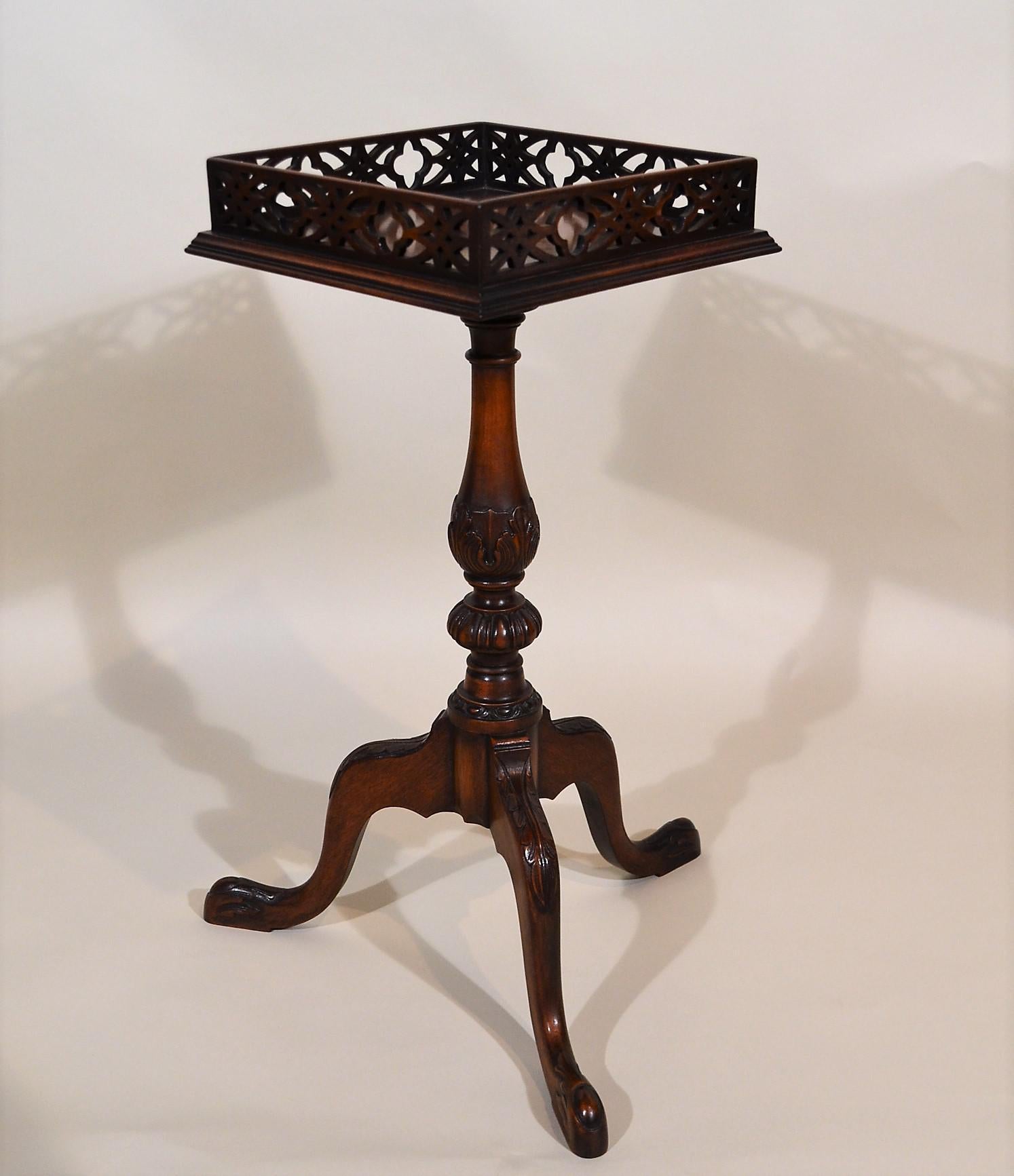 English galleried tripod mahogany side table. This table is made for us in England and is a perfect little occasional piece with handsome lines.