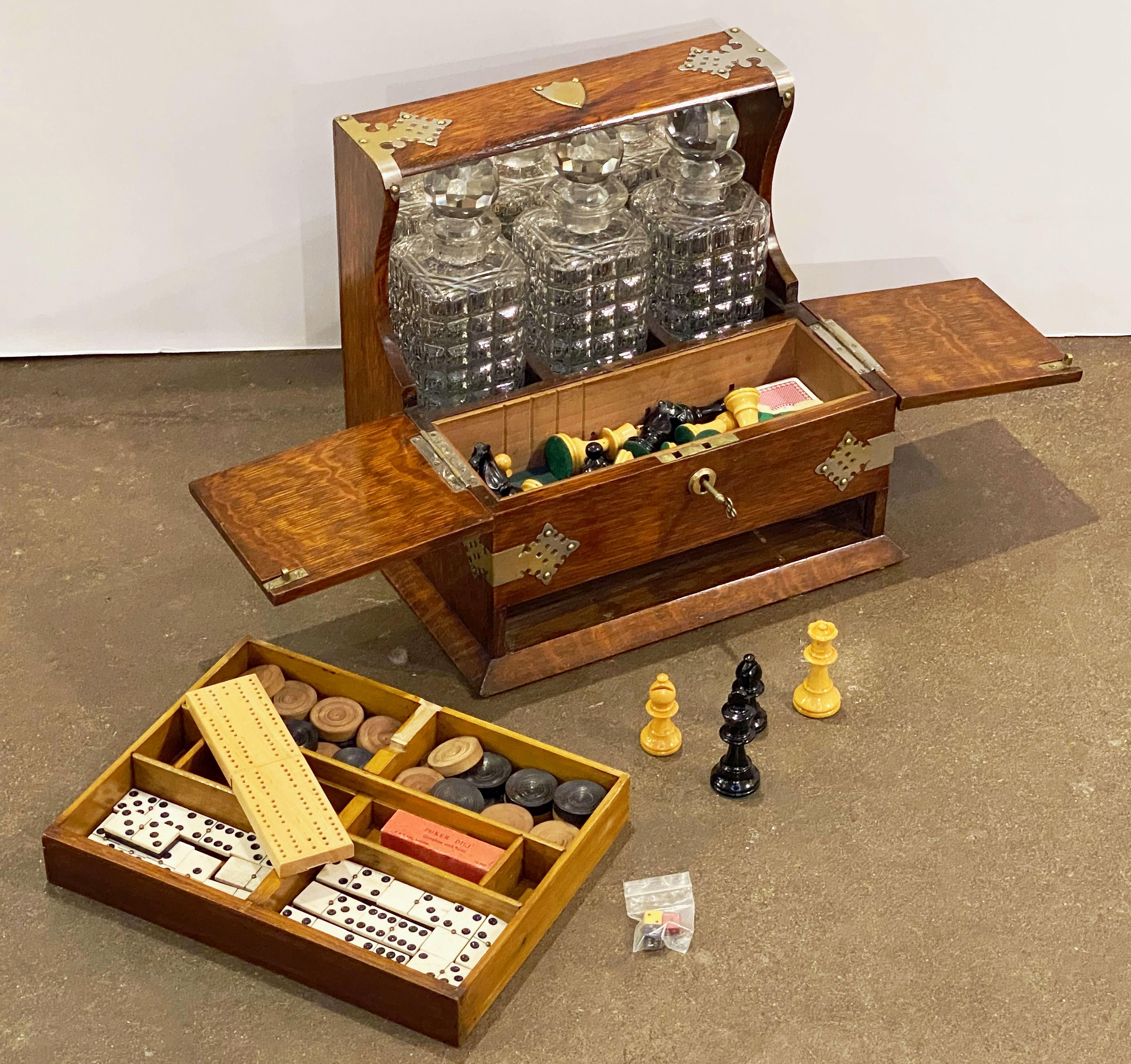 Victorian English Gaming Compendium and Tantalus of Oak with Three Decanters