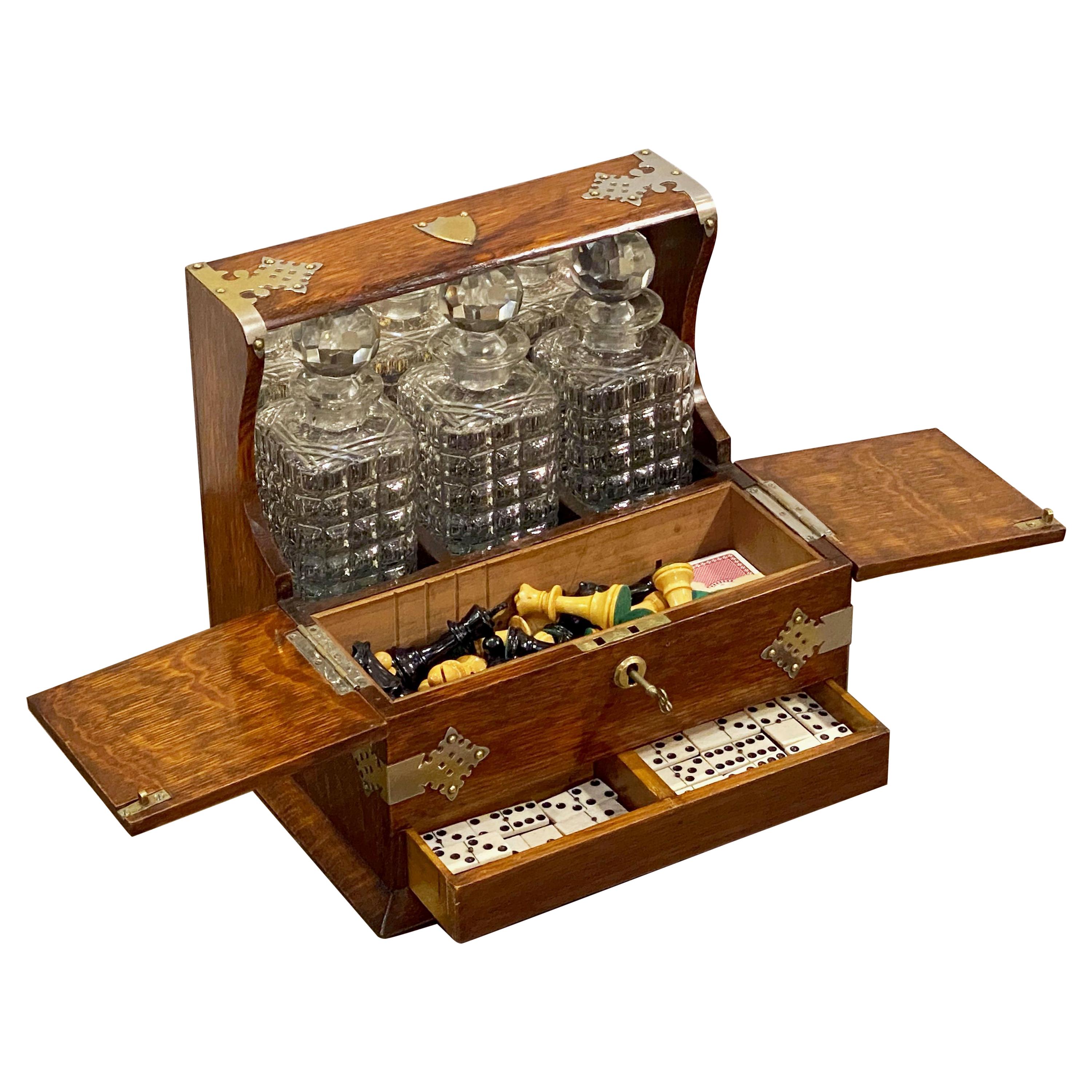English Gaming Compendium and Tantalus of Oak with Three Decanters