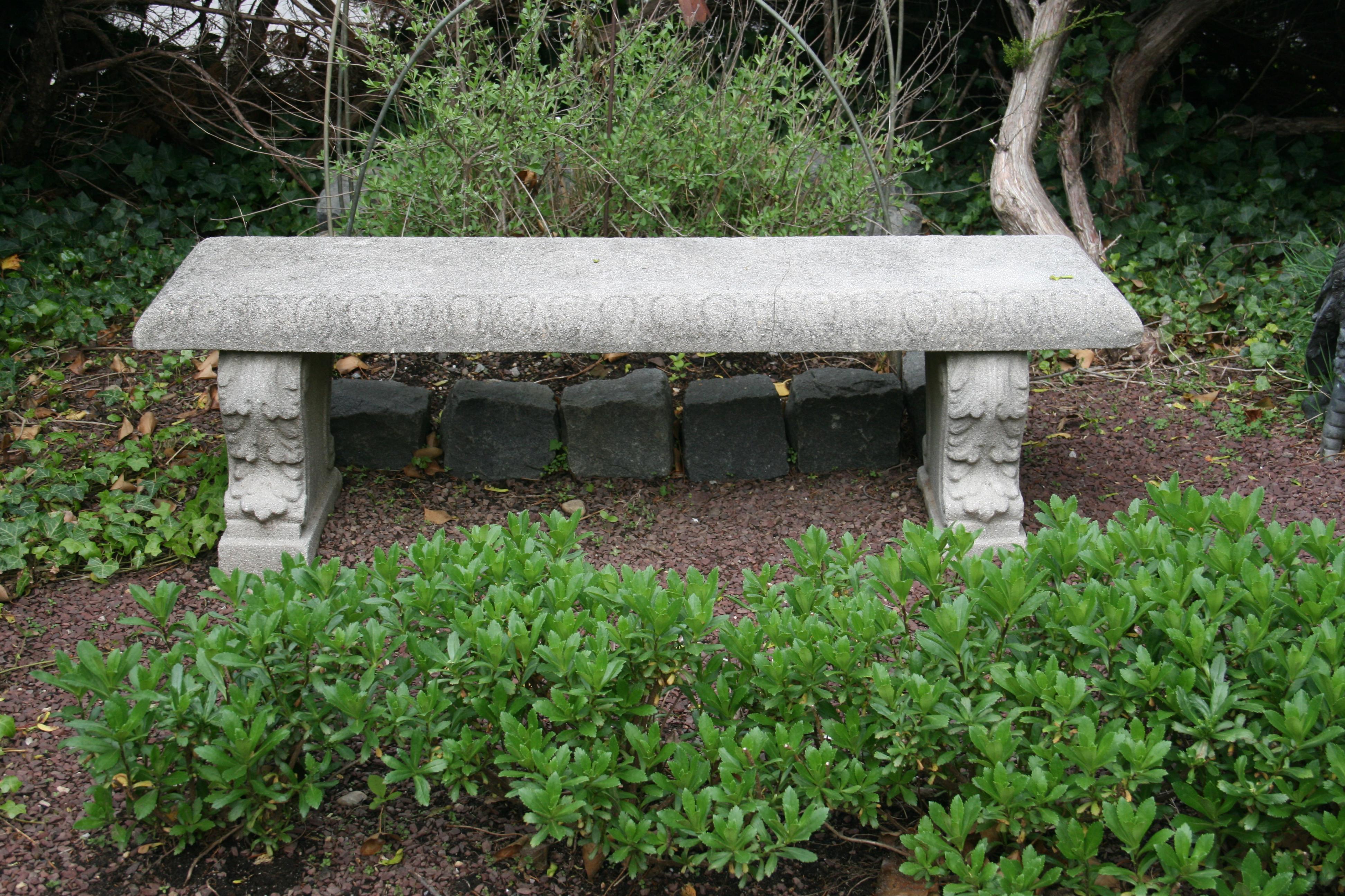 3-1126 A handsome English garden long bench or seat of composition stone,
featuring gadroon edge rectangular top set upon two scroll supports with a relief design of acanthus leaf.