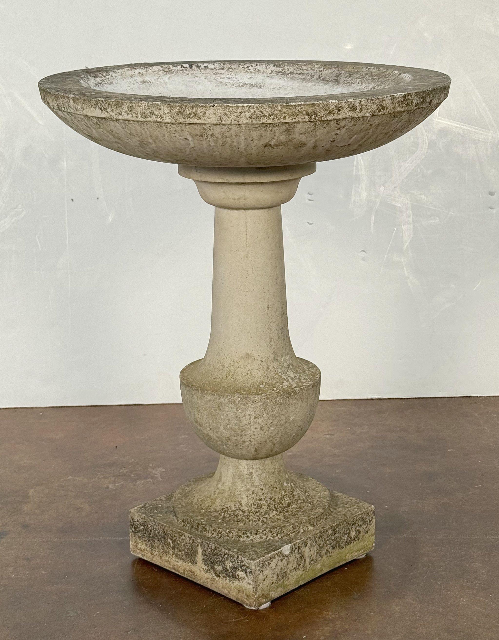 A fine English bird bath (or birdbath) of composition stone, featuring a 22 inch diameter basin top (circular) set upon a Classical baluster pedestal column and raised square plinth base.

Perfect for a garden or outdoor patio!