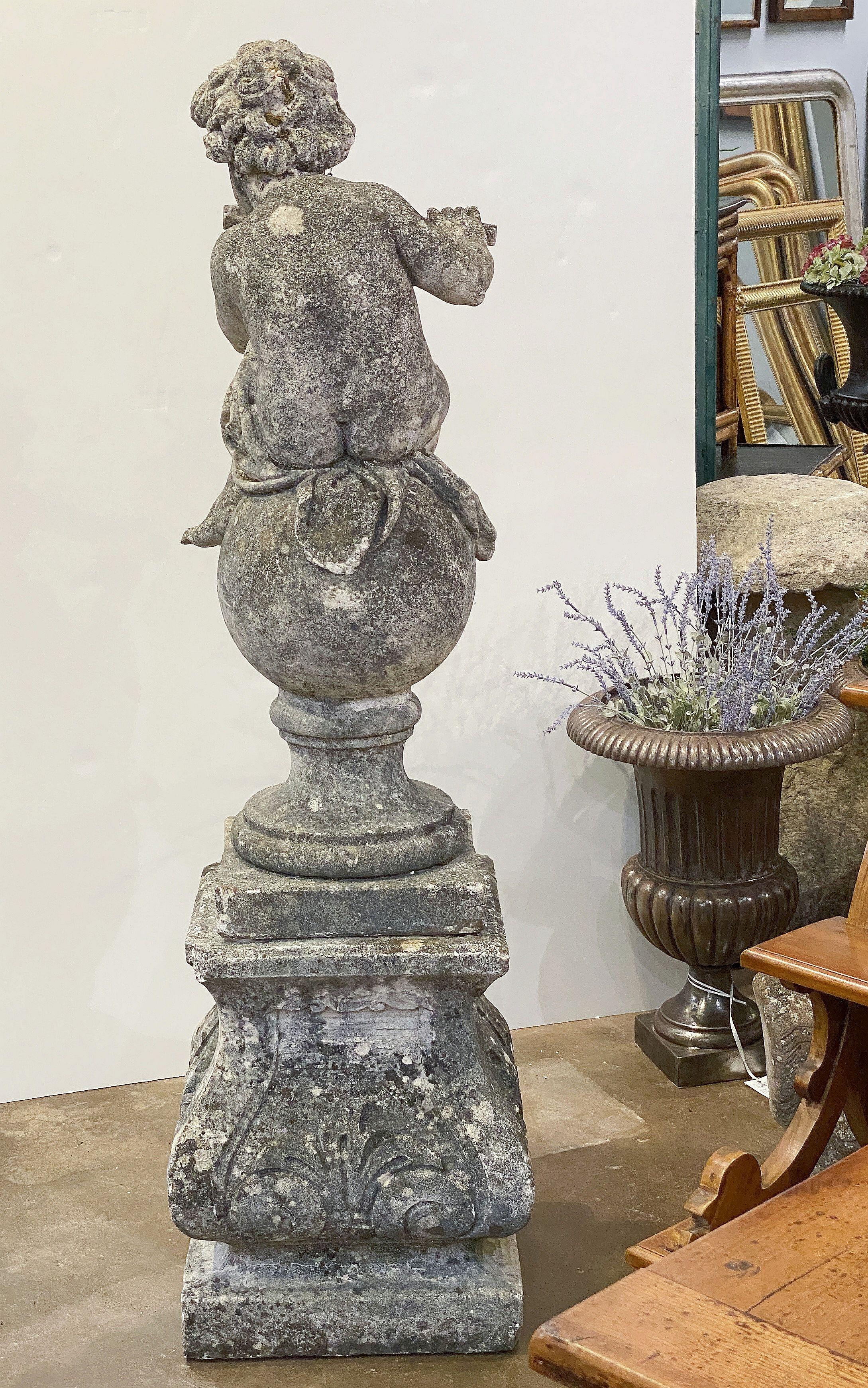 English Garden Stone Figure of a Child Putti Playing Flute on a Plinth Base For Sale 4