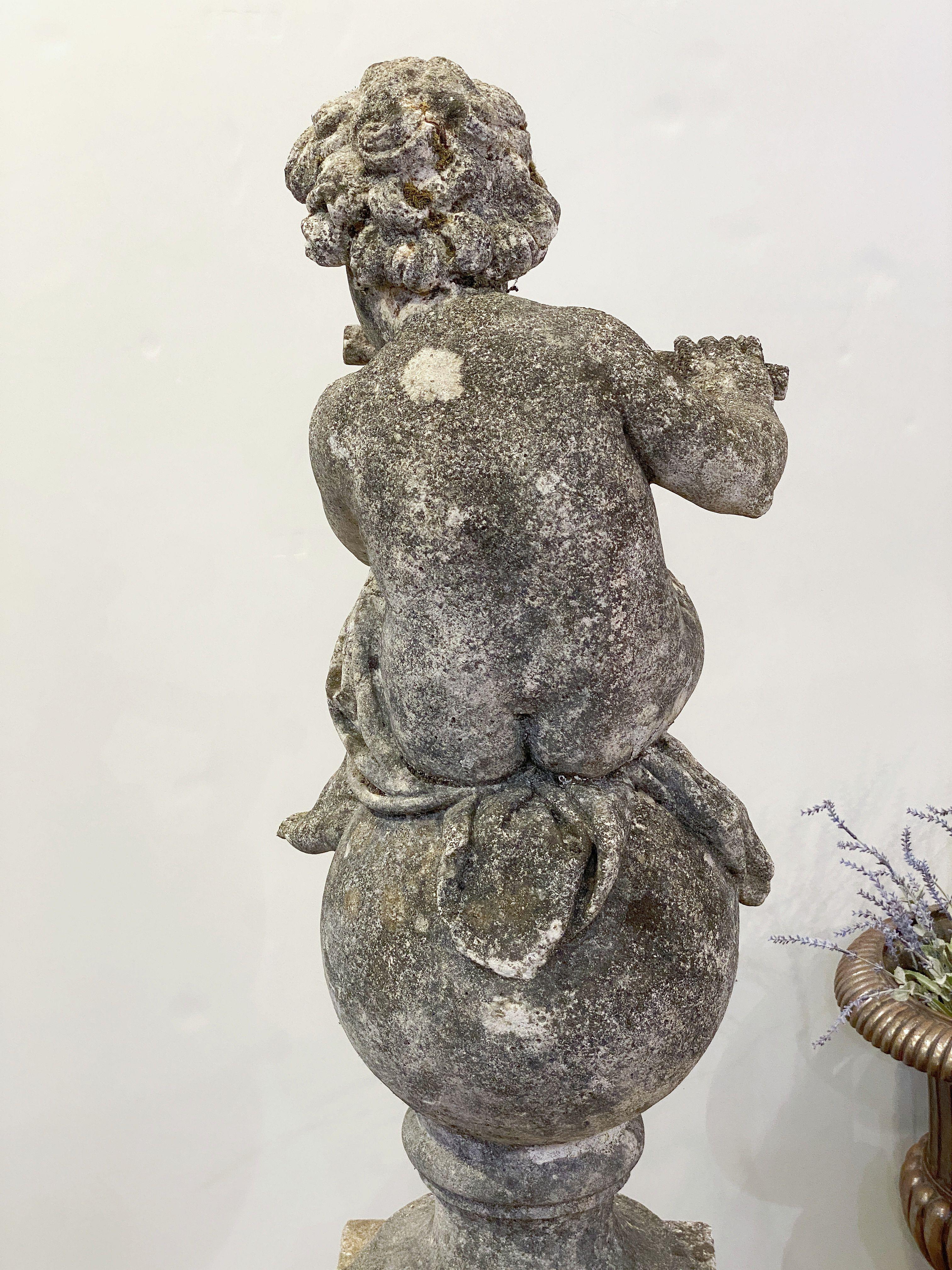 English Garden Stone Figure of a Child Putti Playing Flute on a Plinth Base For Sale 6