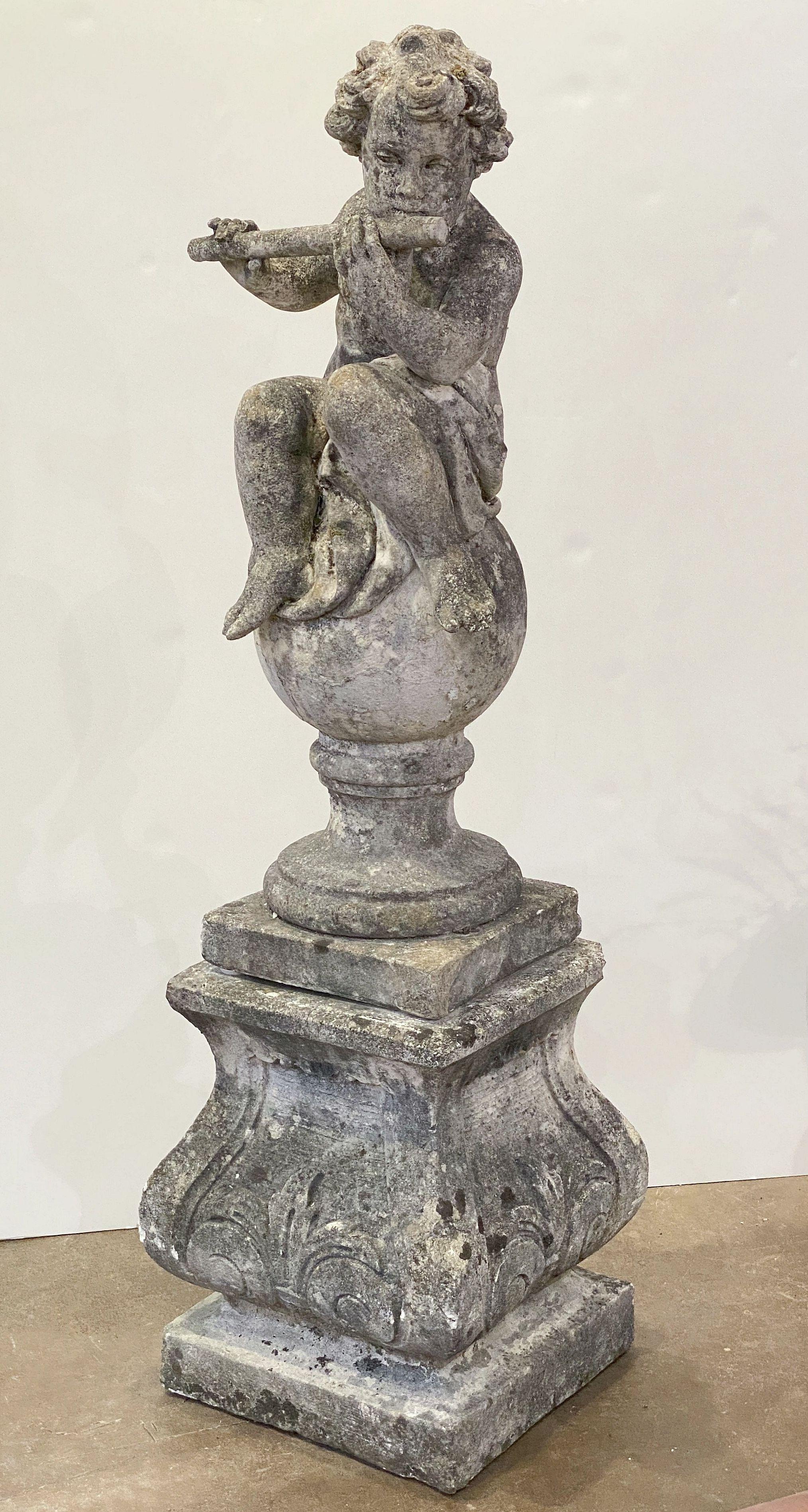 Classical Roman English Garden Stone Figure of a Child Putti Playing Flute on a Plinth Base For Sale