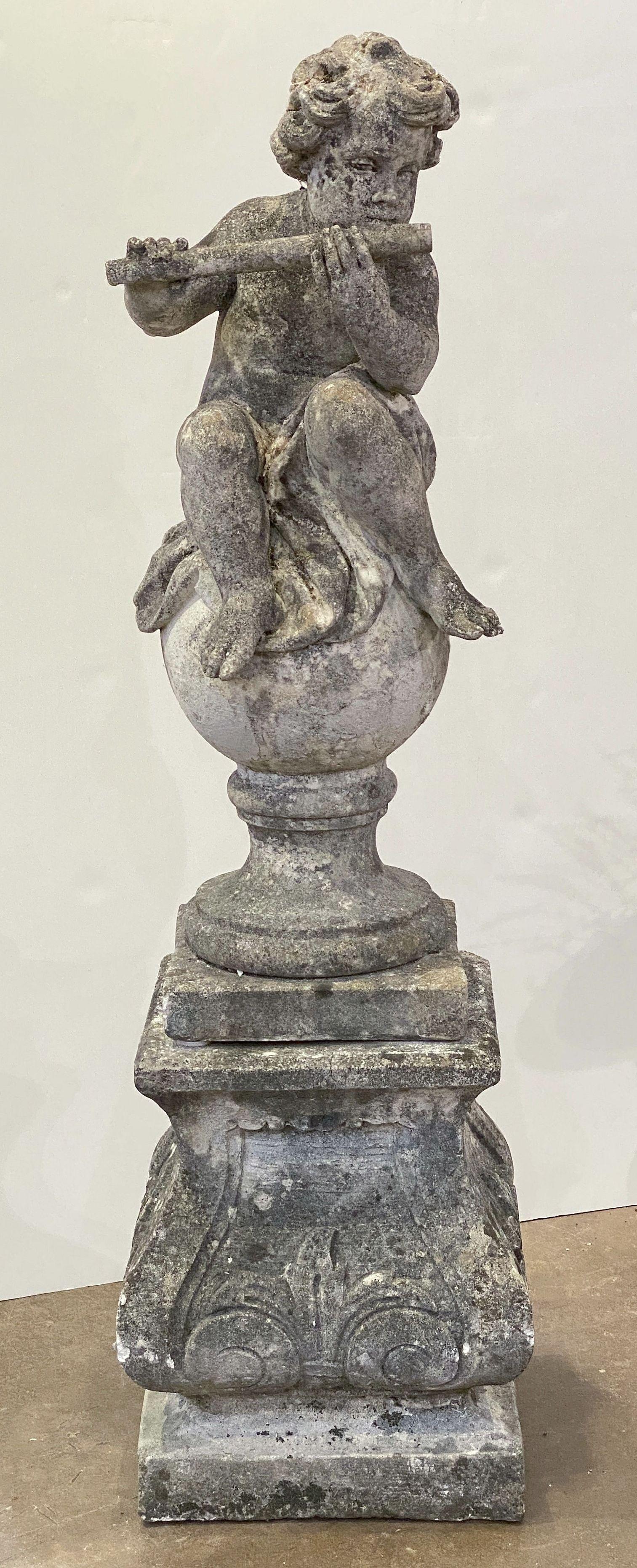 20th Century English Garden Stone Figure of a Child Putti Playing Flute on a Plinth Base For Sale