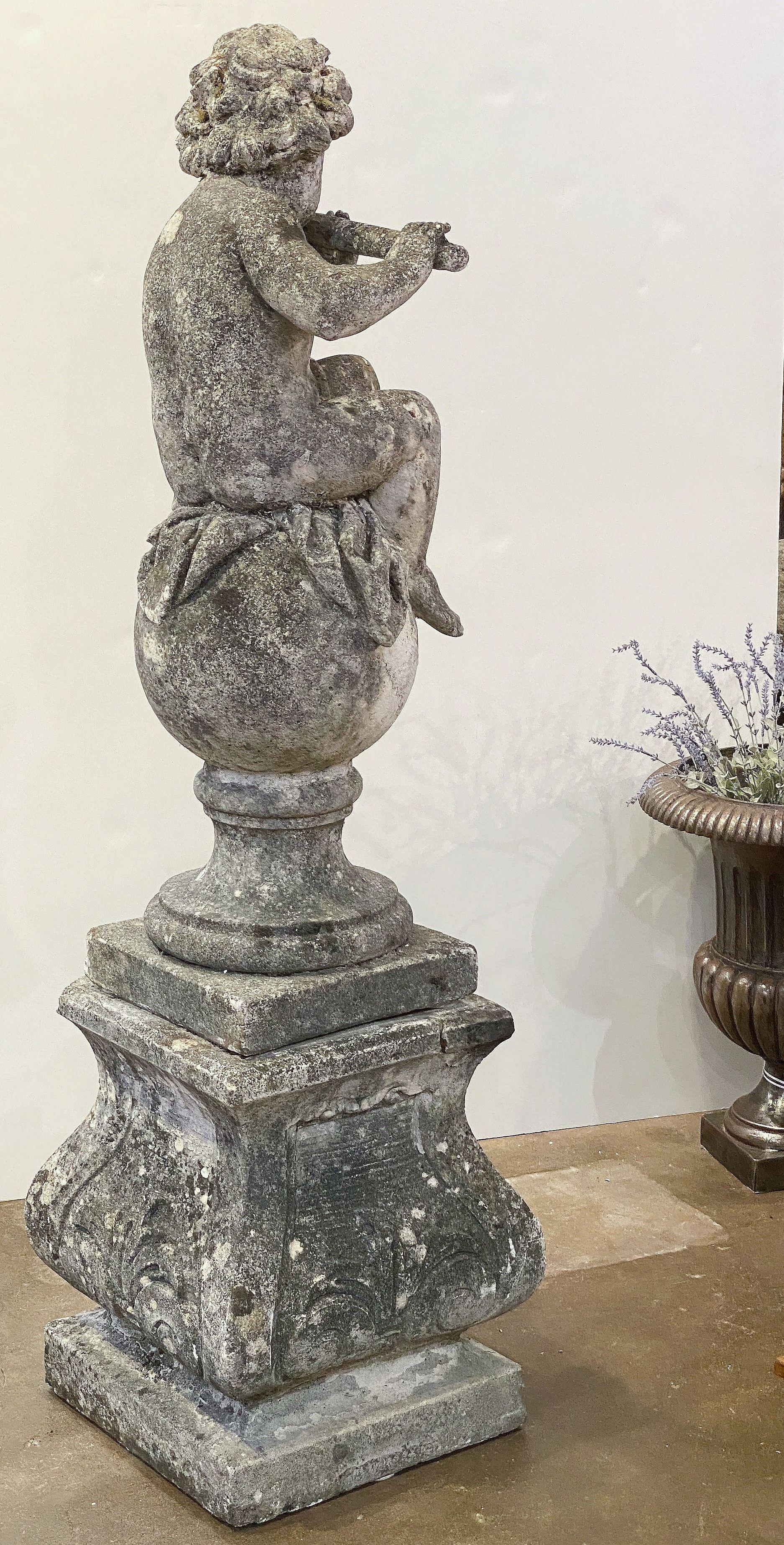 English Garden Stone Figure of a Child Putti Playing Flute on a Plinth Base For Sale 2