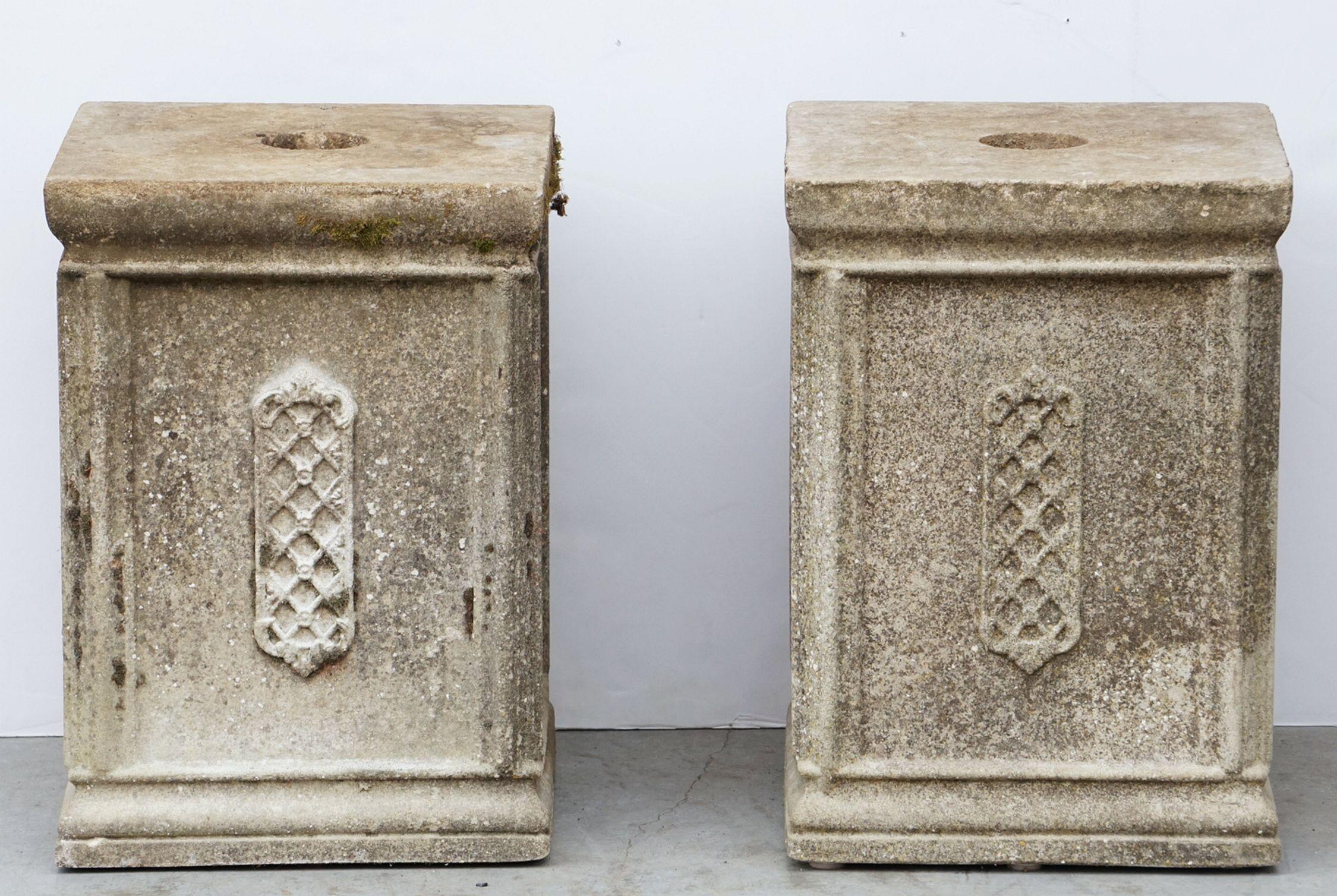 A fine pair of English four-sided column pillars or pedestal plinth supports of composition stone - for urns, planters, or statuary.
Each pedestal plinth featuring a stylish Gothic or Celtic design on each facing side.

Perfect for an indoor or