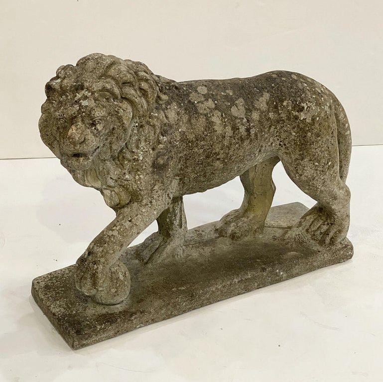 A handsome English standing or statant lion on raised graduated square plinth of weathered composition stone - with great detail to head and mane.

Perfect for a garden room or conservatory!

