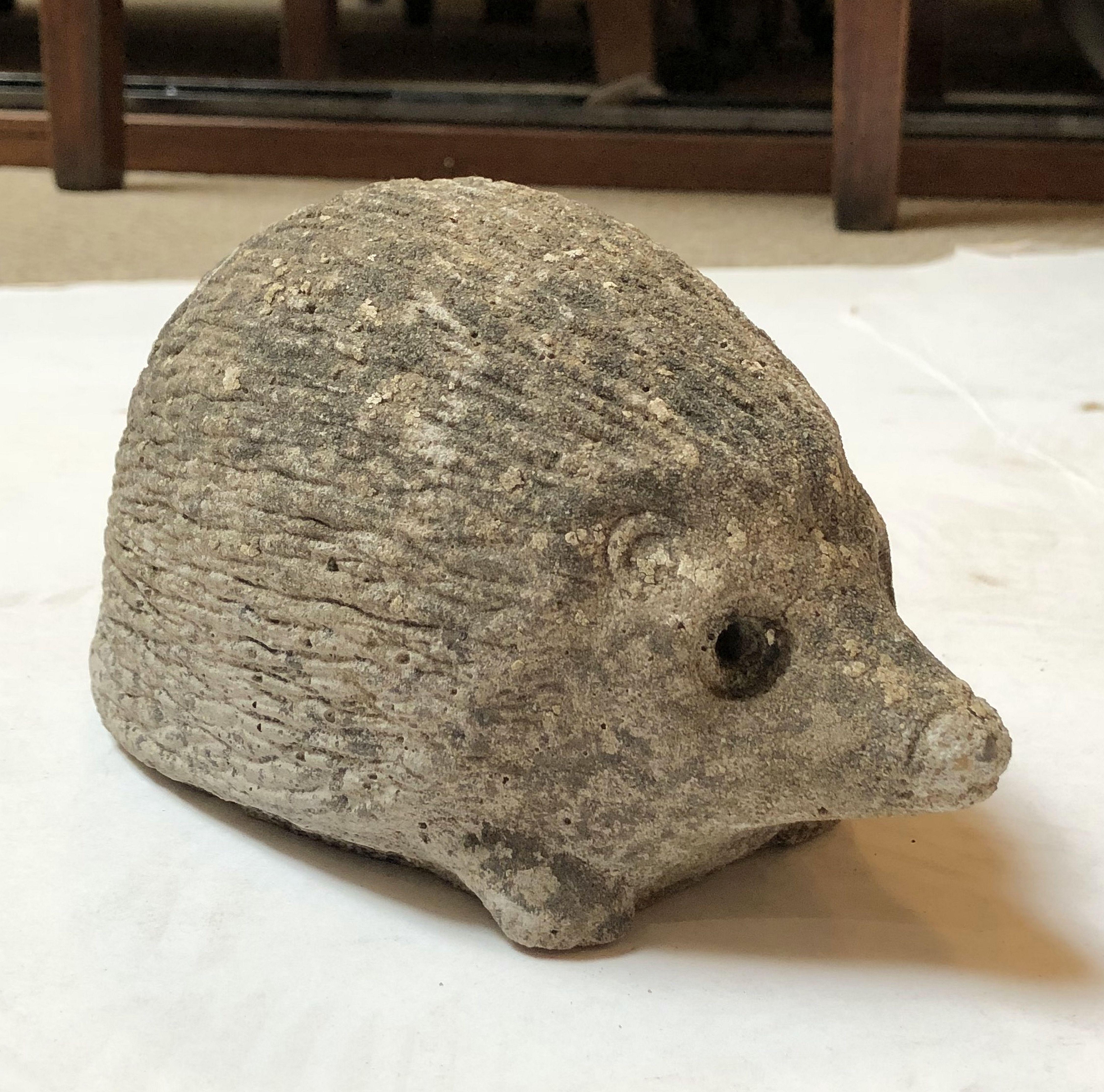 A handsome English garden statue figure of a hedgehog, of composition stone, with excellent in the round modeling.

Perfect for a garden room or conservatory.

 