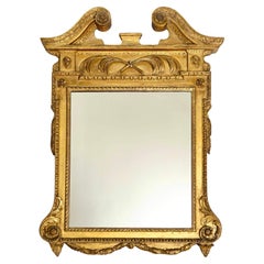 Specchio inglese di Giorgio II in legno dorato alla maniera di William Kent, 1735 ca.