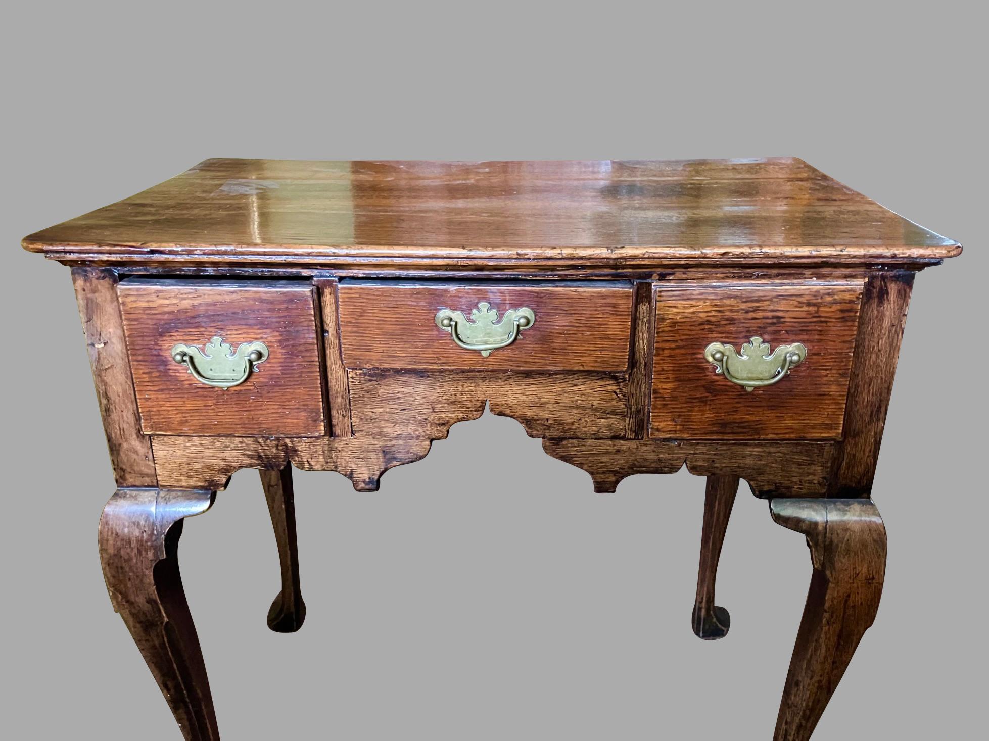 Mid-18th Century English George II Period Provincial Oak Lowboy with Original Brasses For Sale