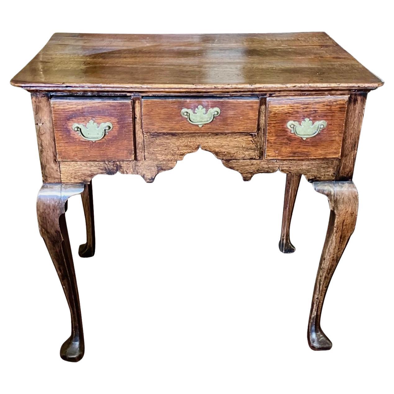 English George II Period Provincial Oak Lowboy with Original Brasses For Sale