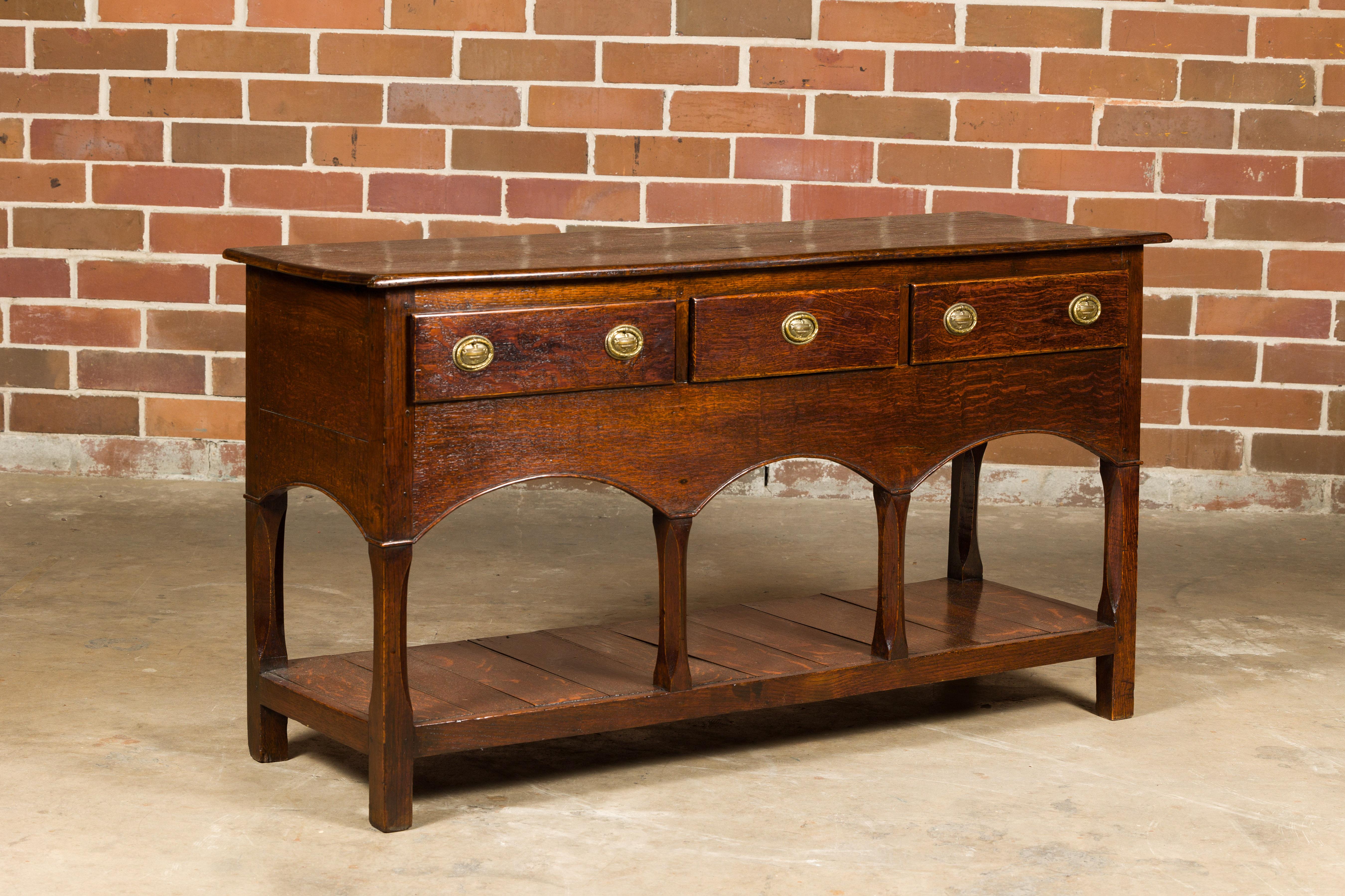 English George III 1800s Oak Dresser Base with Three Drawers and Arching Accents For Sale 4