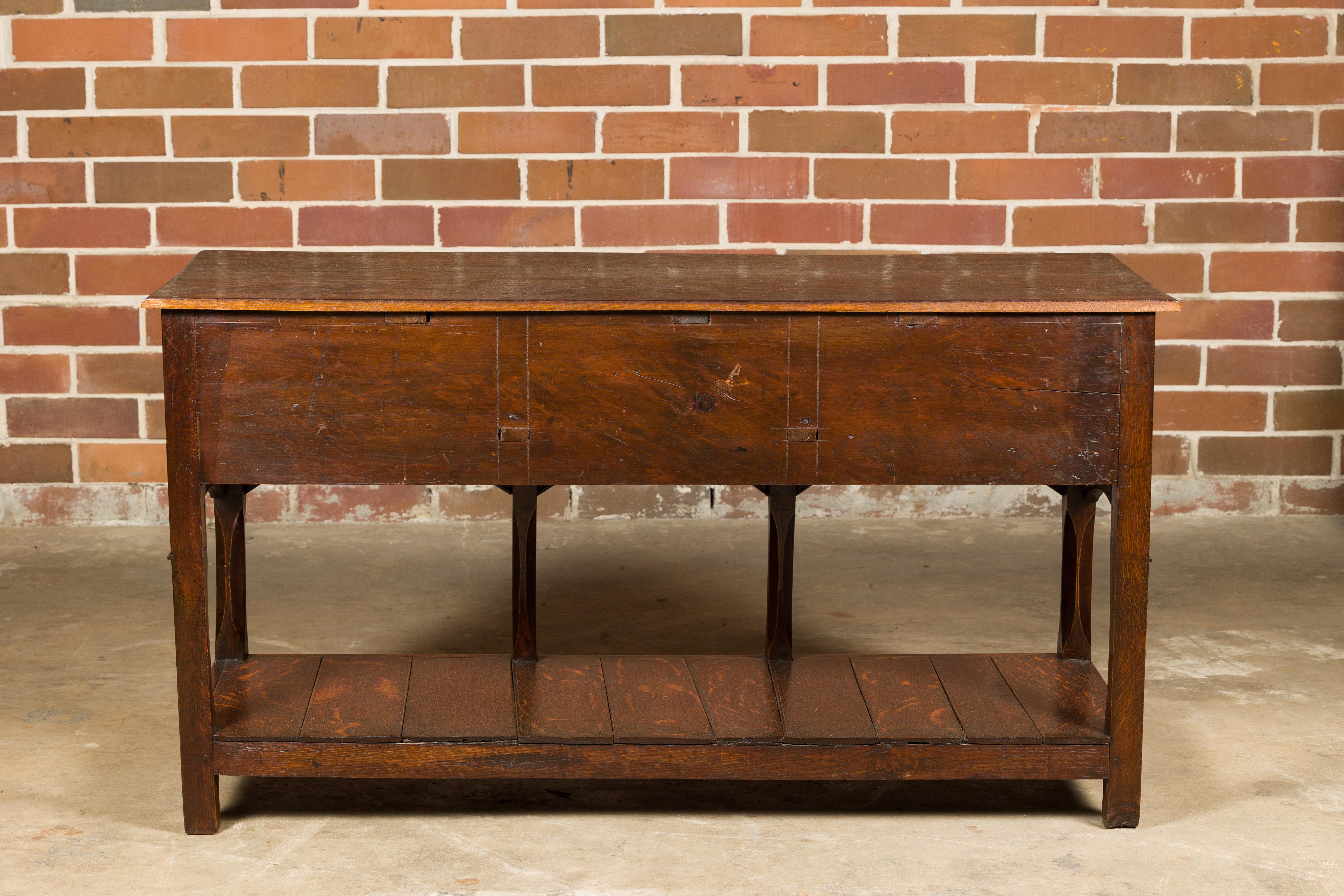 English George III 1800s Oak Dresser Base with Three Drawers and Arching Accents For Sale 7