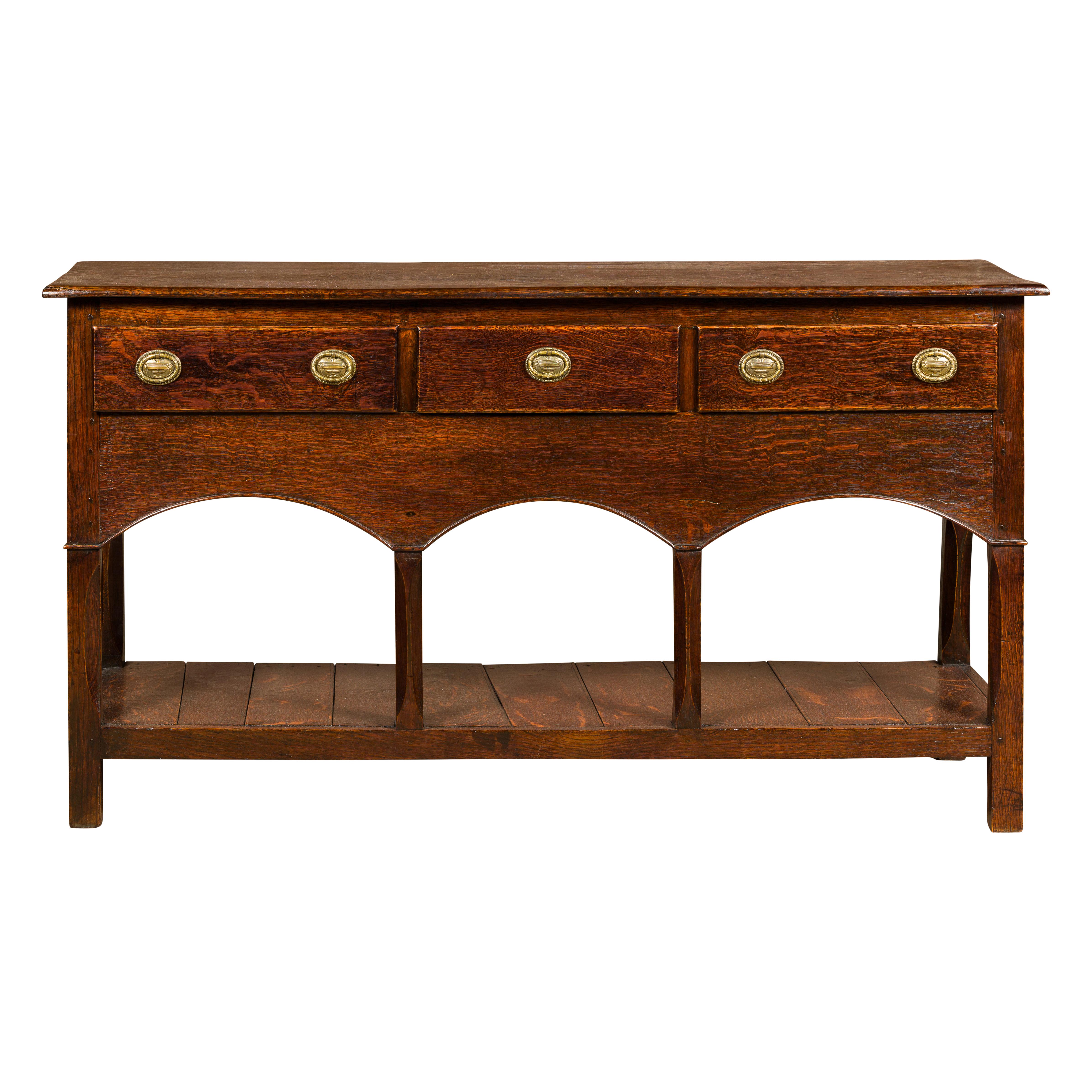 English George III 1800s Oak Dresser Base with Three Drawers and Arching Accents For Sale 10