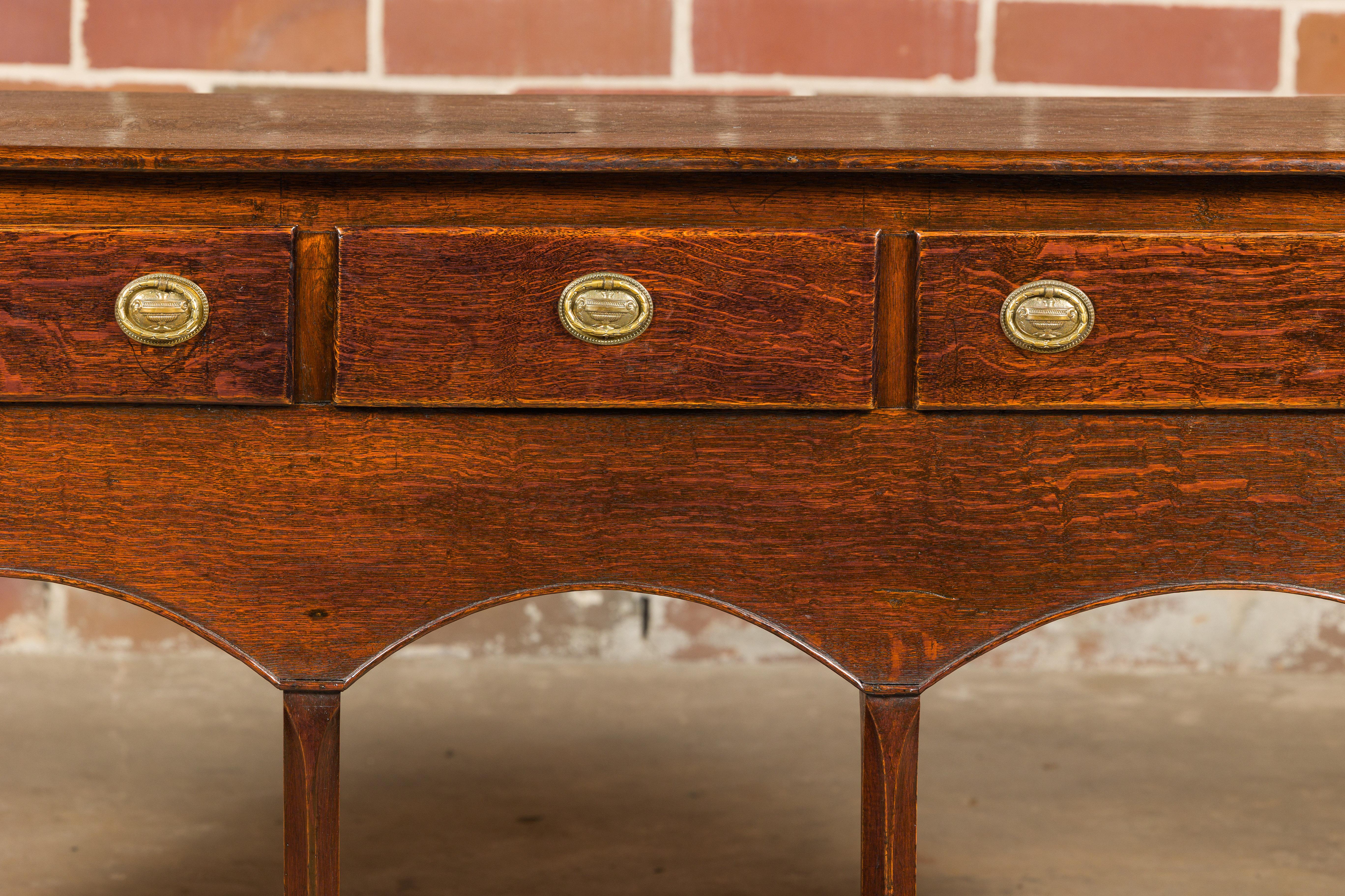 19th Century English George III 1800s Oak Dresser Base with Three Drawers and Arching Accents For Sale