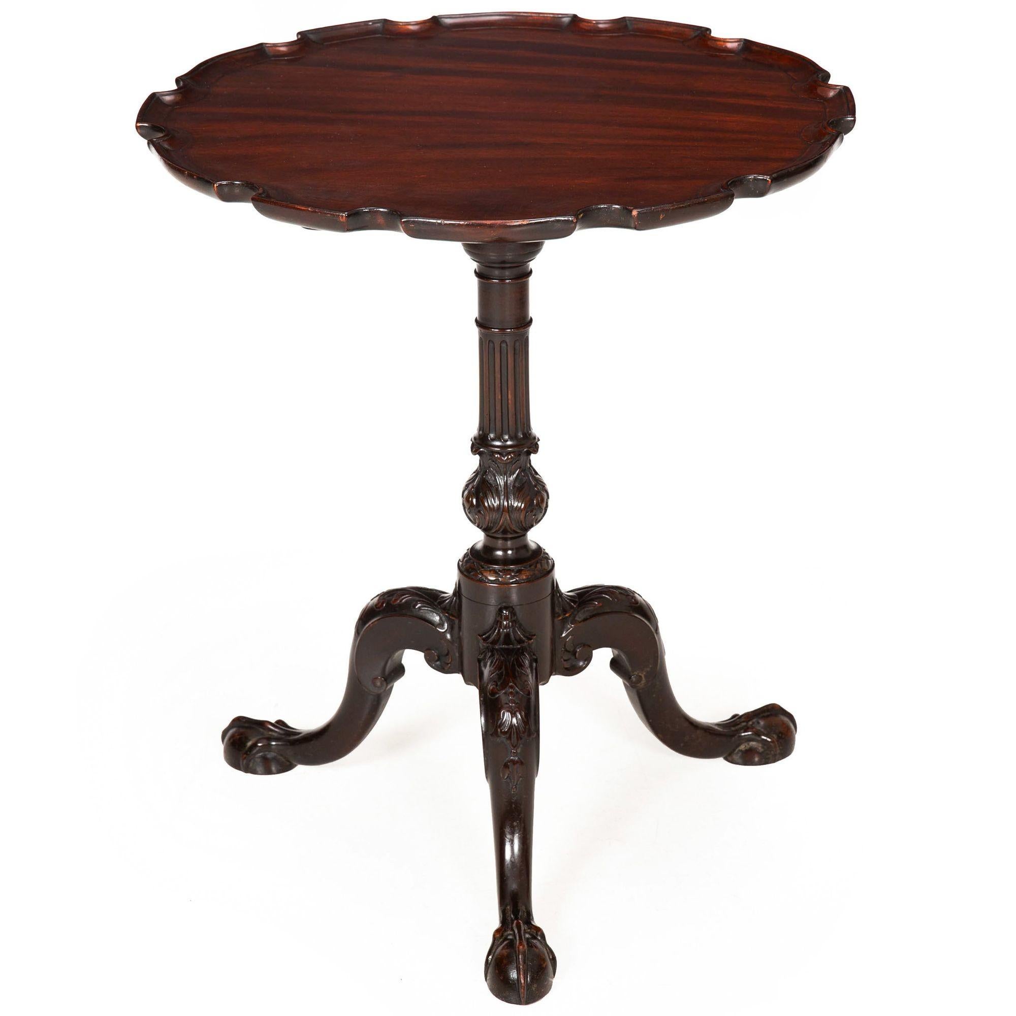 ENGLISH GEORGE III CARVED MAHOGANY PIE-CRUST TILT-TOP TABLE
With a very finely and expressively carved baluster, over tripodal anthemion carved legs terminating in ball-and-claw feet  circa 1780
Item # 408LTW21A

A remarkably exhuberant piece, this