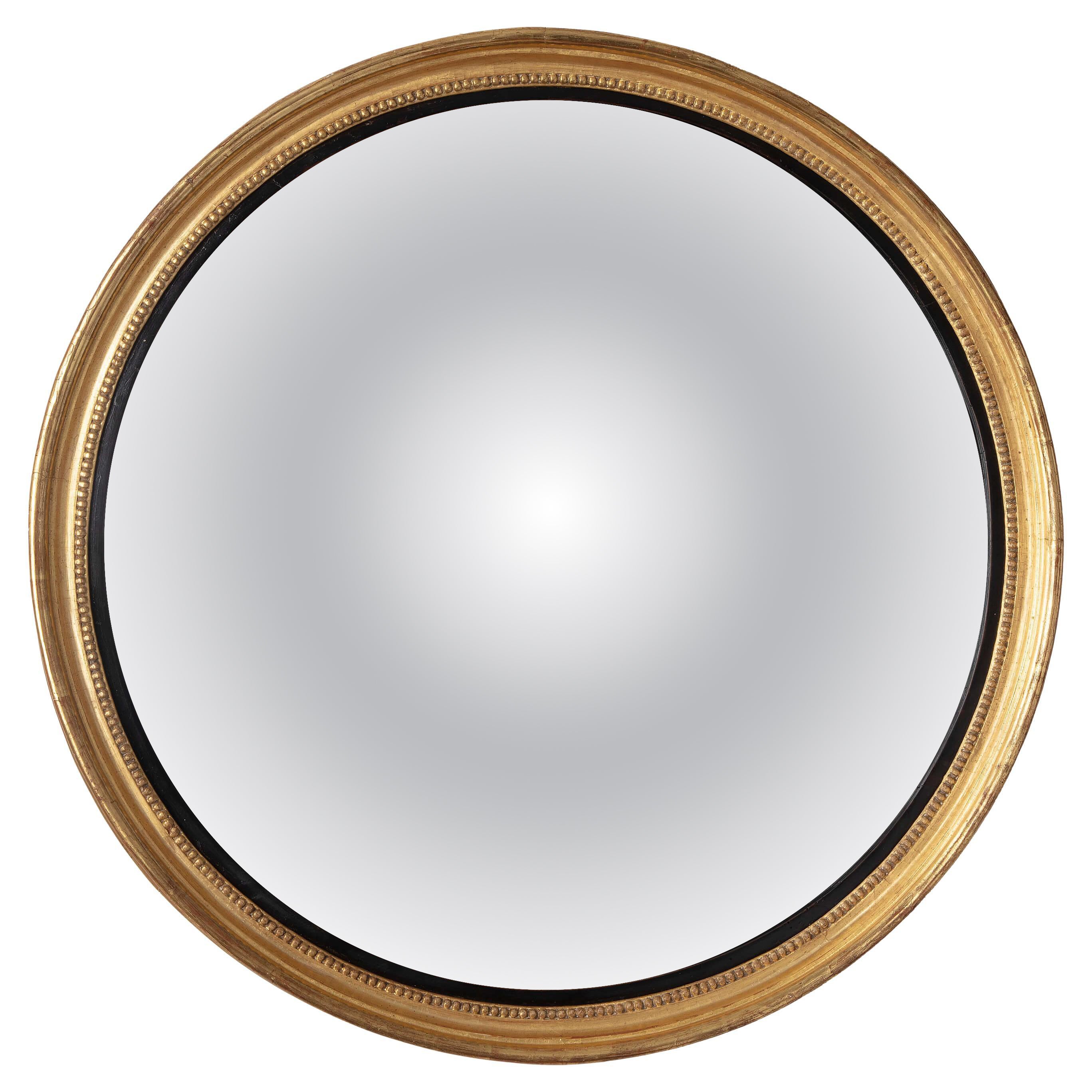 English George III Giltwood and Ebonized Frame Convex Mirror, circa 1800 For Sale