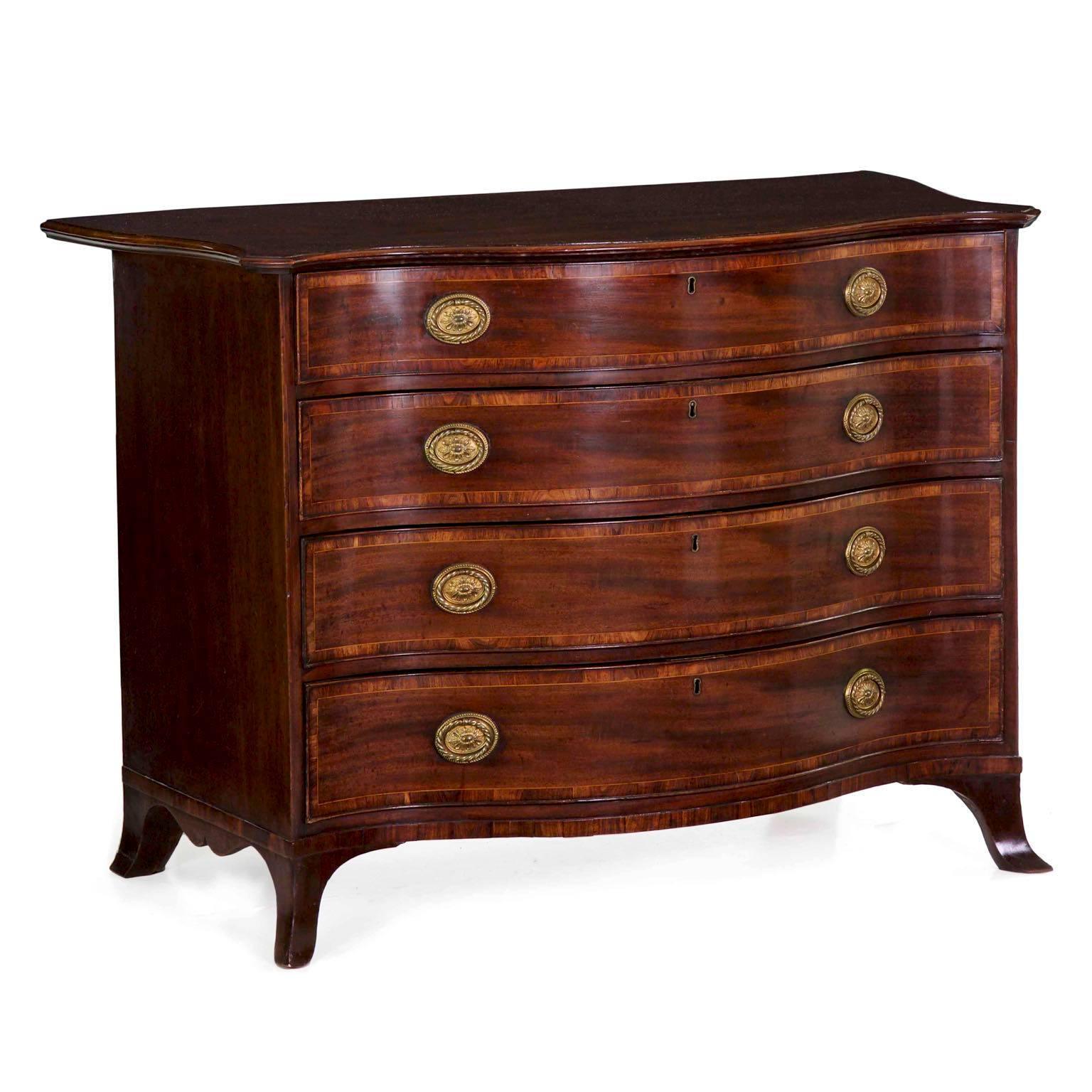 A very fine example of the George III period, this chest presents with a boldness of form that is unusually moving. The undulating top has an exaggerated projection around all three sides, the front edge perfectly conforming to the serpentine