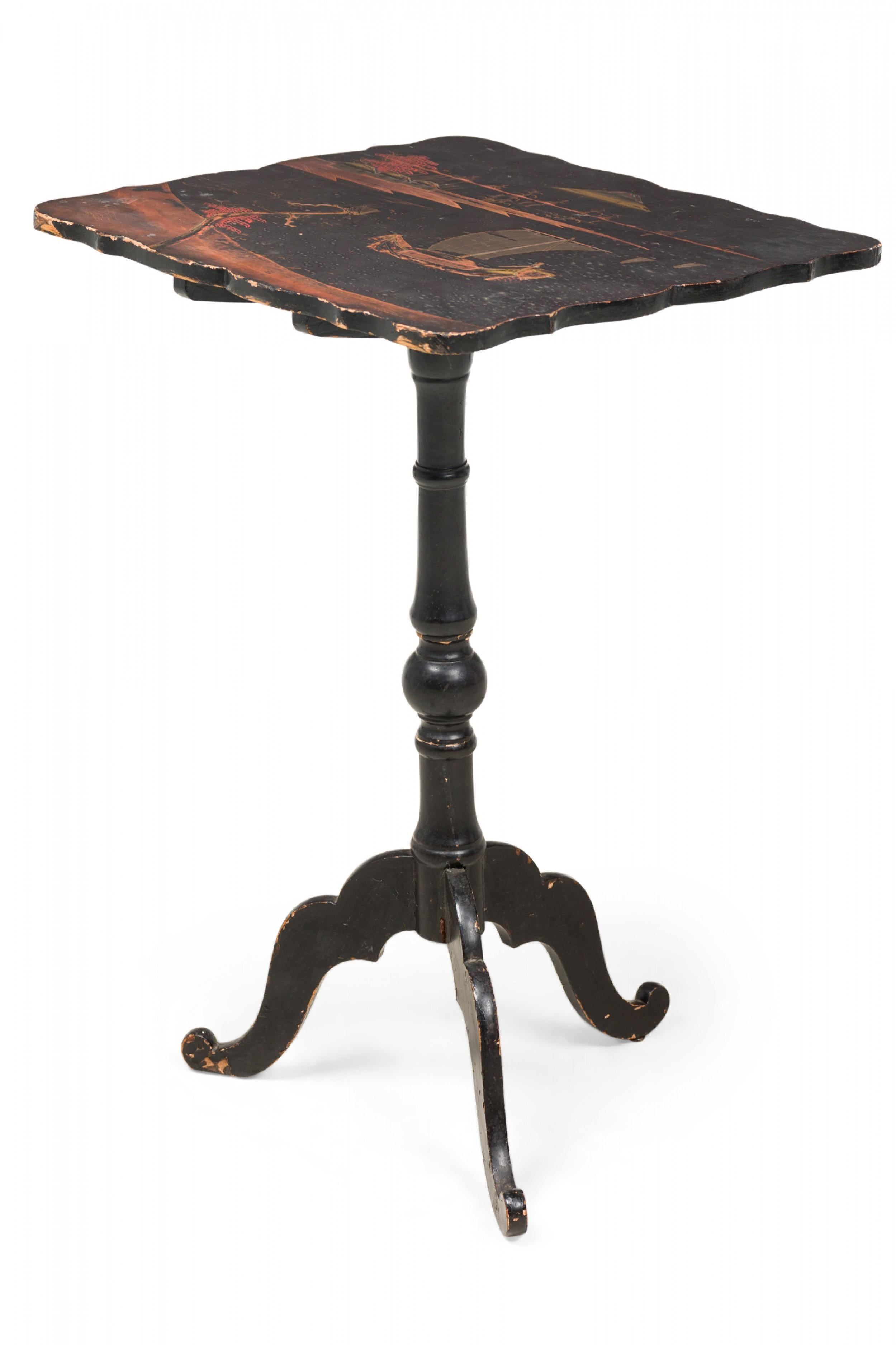 English George III Japanned tilt top end / side table featuring a tabletop with a scalloped edge decorated with a painted and gilt pastoral scene of boats on water with a mountain in the distance, resting on a turned pedestal with three shaped