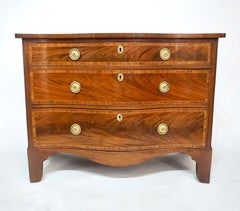 George III Mahogany, Kingwood, and Satinwood Serpentine Commode, circa 1785