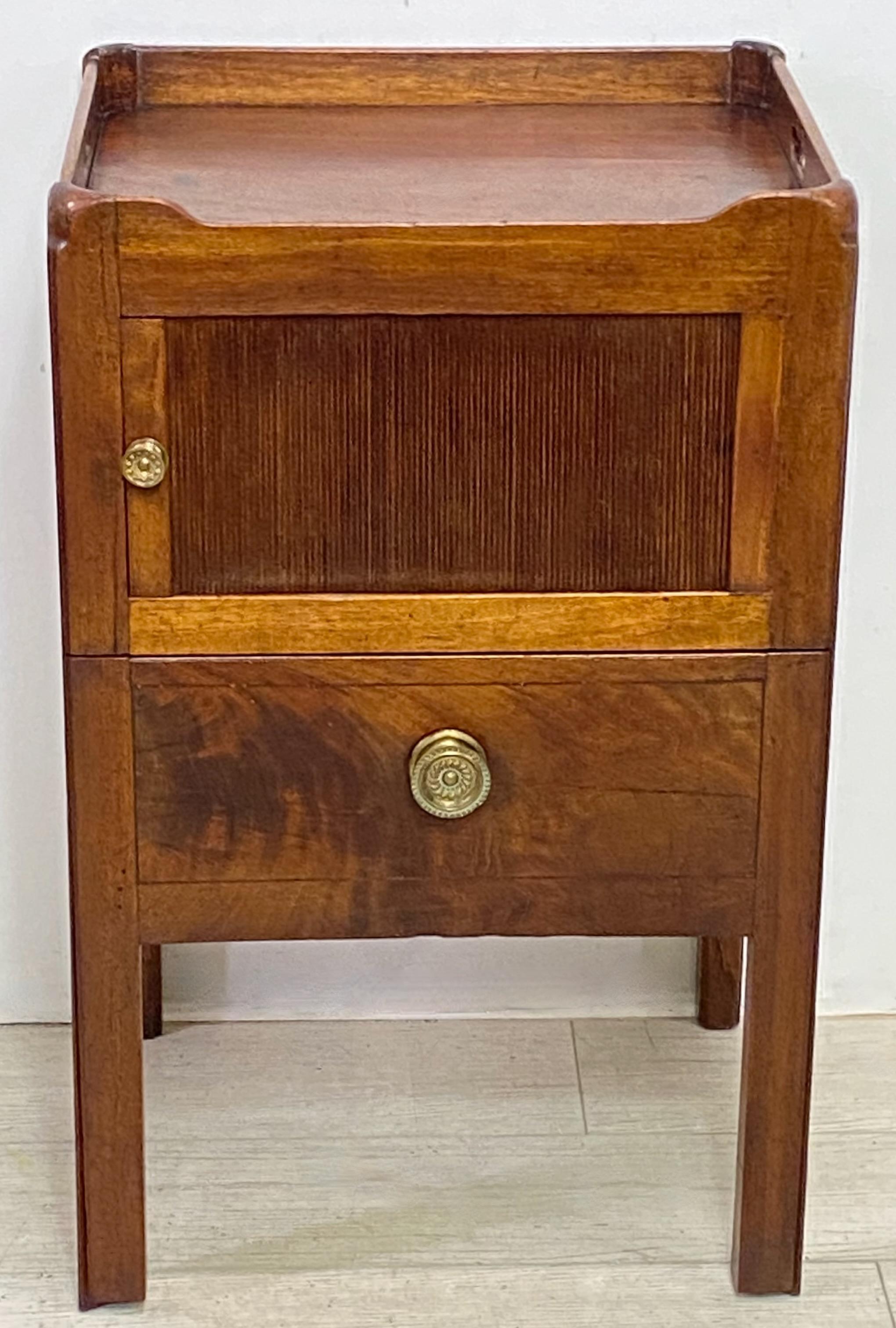 George III period mahogany side cabinet / table with sliding tambour door.
What was once the commode drawer has been converted to a deep storage drawer.
Refreshed original finish.
England, early 19th century, circa 1810.

