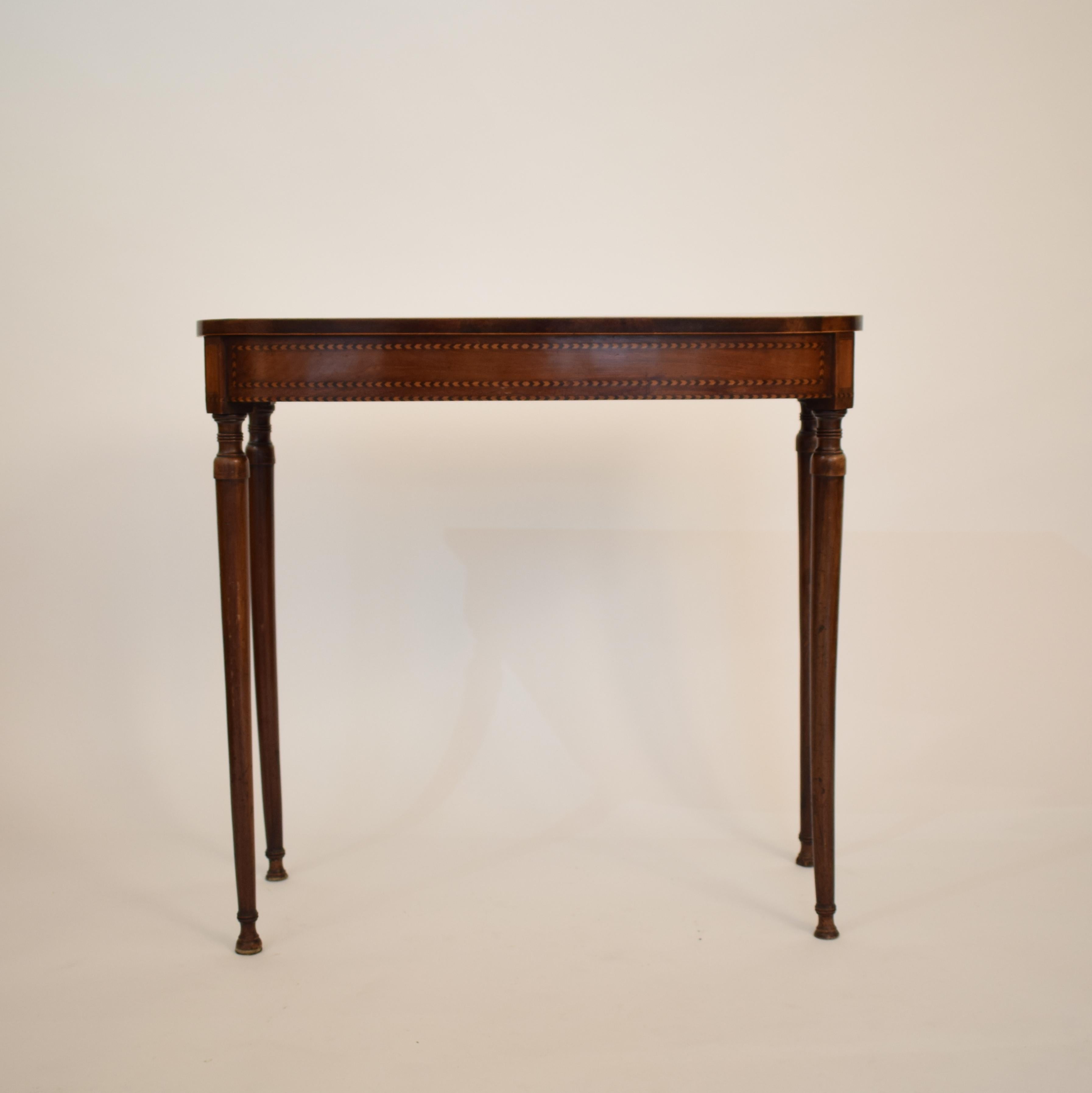 This elegant mahogany console table was made in England in 1780. 
It is the George III period. 
It has some fine marquetry and is in it original condition with a beautiful patina.
 