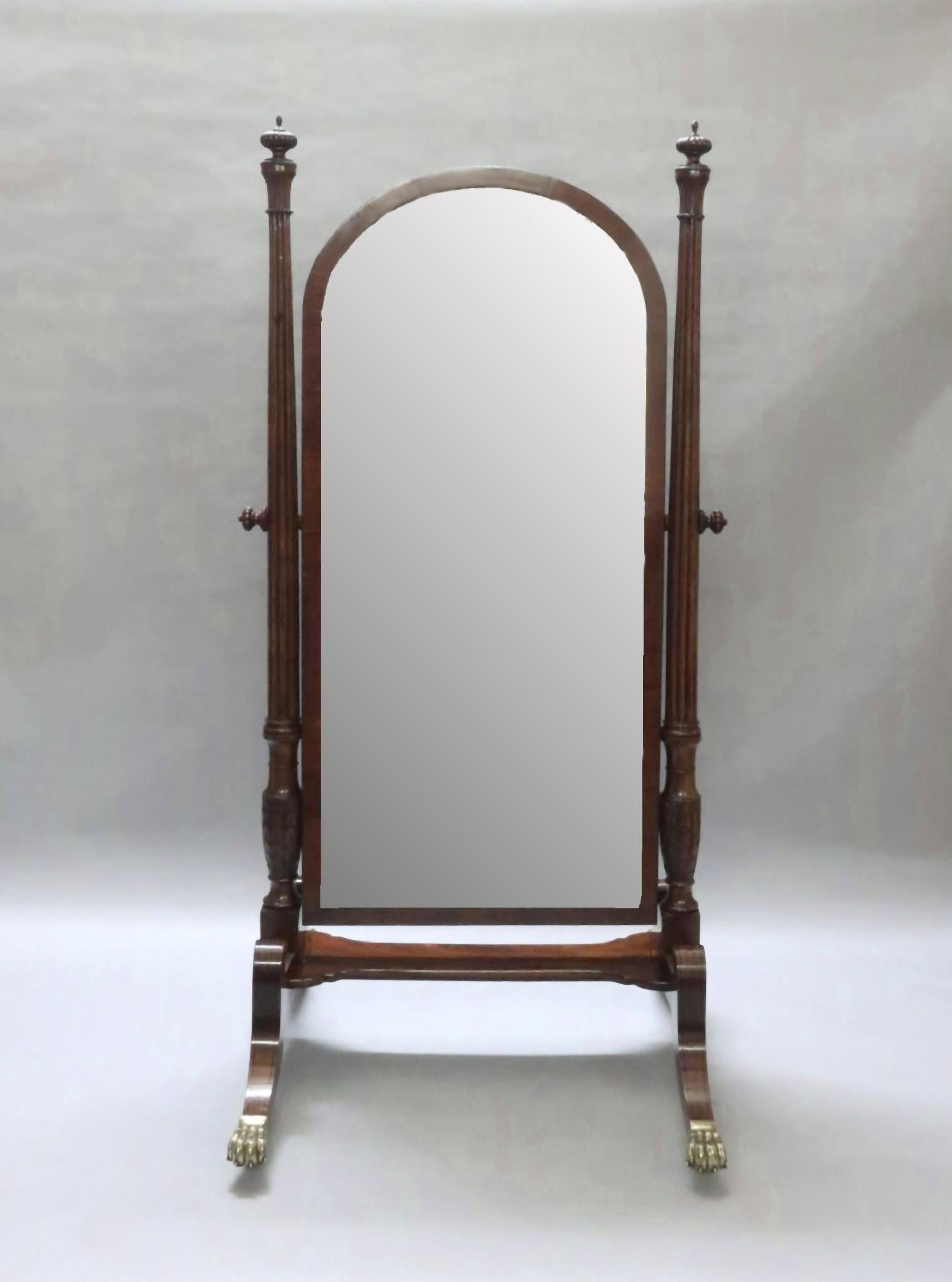 A fabulous quality and impressive George III mahogany country house cheval mirror attributed to Gillows of Lancaster. The mirror base has four 'c' scroll tapering sabre legs with ebony string inlay in a geometrical design terminating to substantial