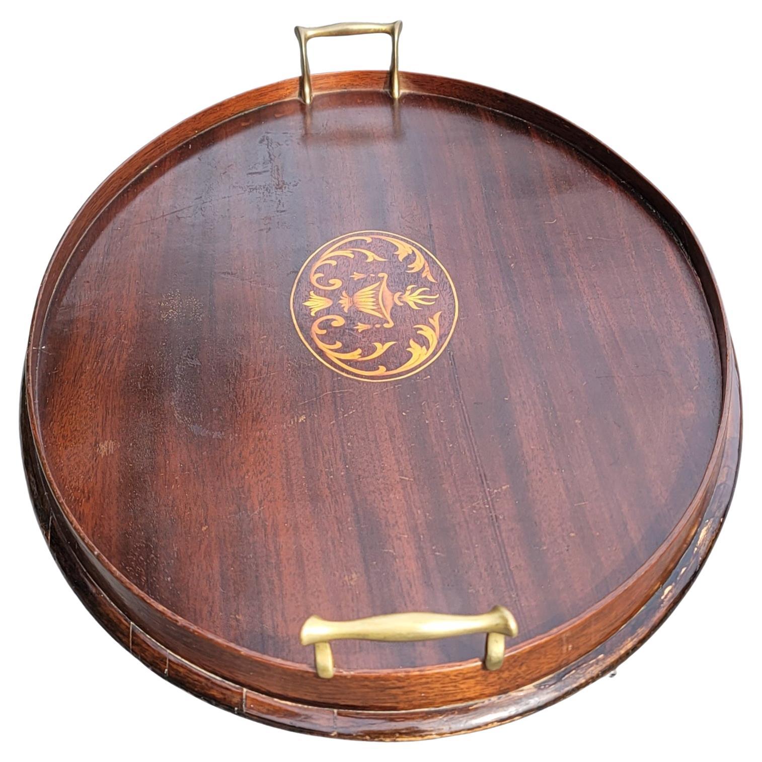 An English George III Mahogany Gallery and Inlay Serving tray with brass handles.
Measures 25